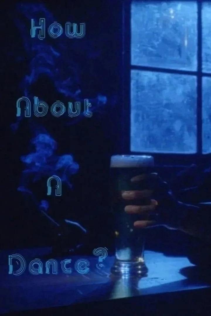 A person holding a glass of dark beer with a blue-tinted window in the background. The text overlay reads, "How about a dance?"
