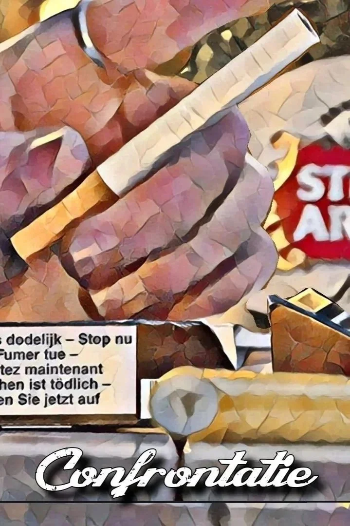 Close-up of a person holding a cigarette with packaging in the background, surrounded by other cigarettes and miscellaneous items on a surface.