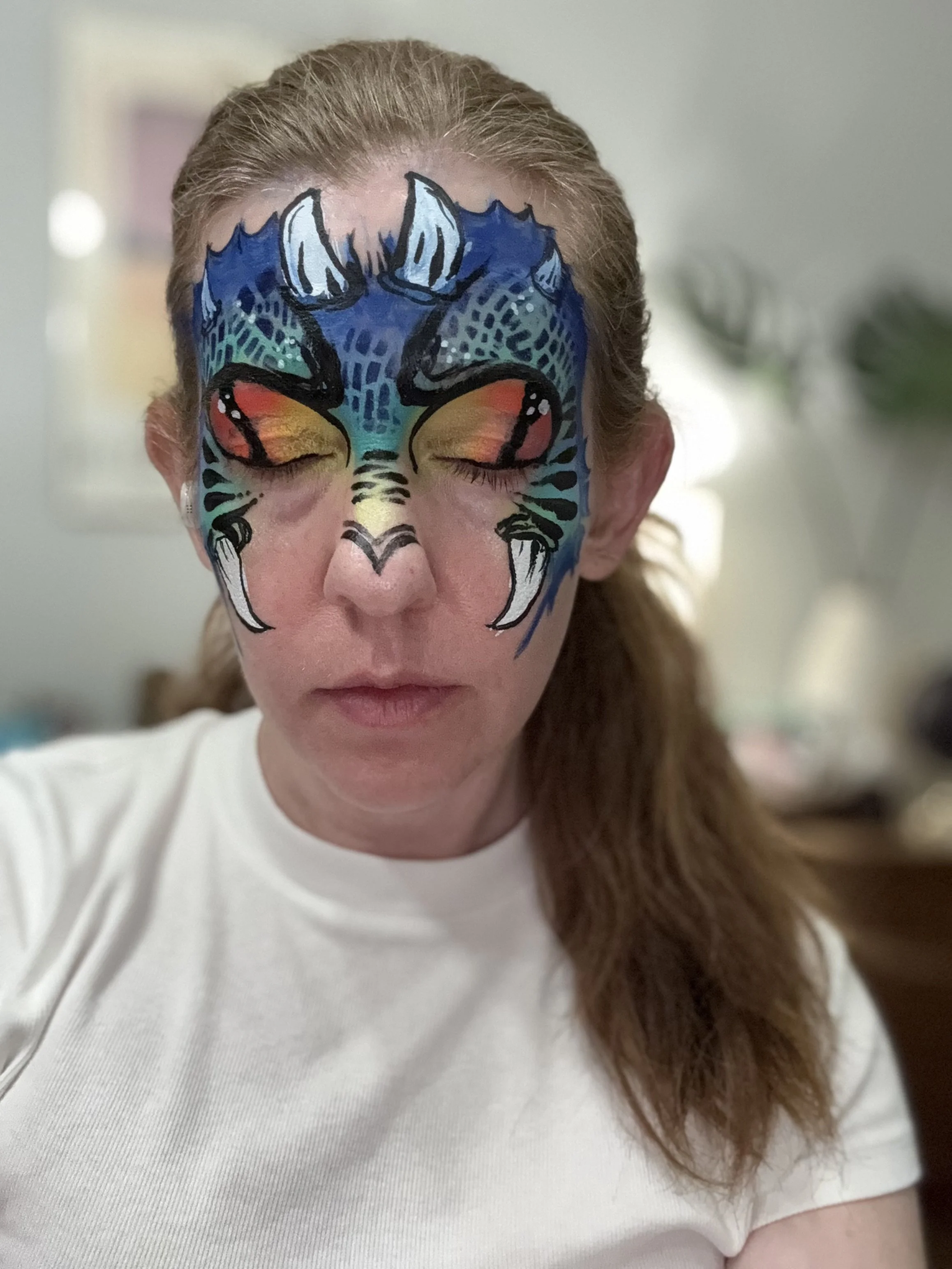 Fierce face paint designs like this dragon for every kid at every age.