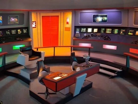 The classic Star Trek spaceship bridge with control panels, chairs, and a central command console.