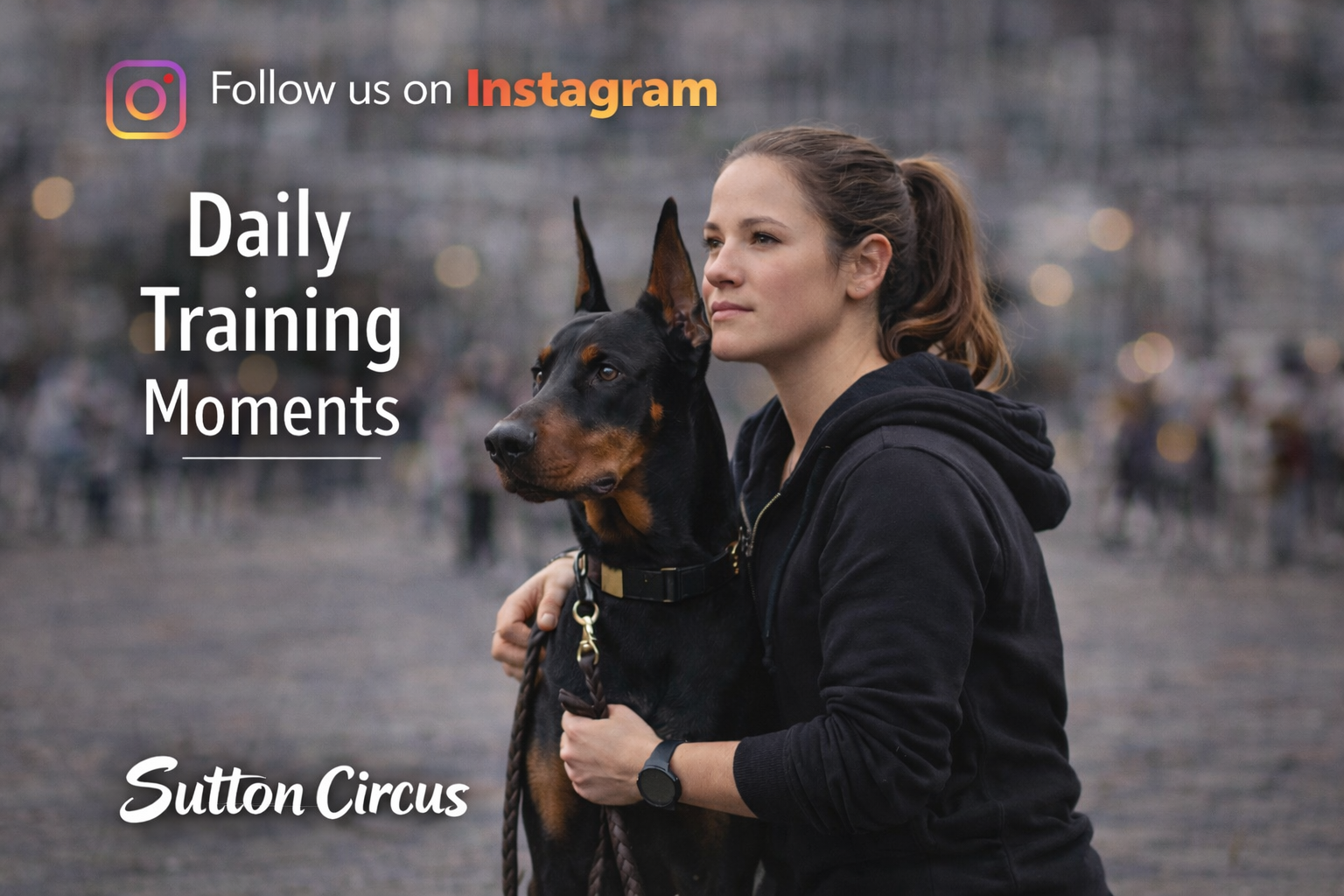 A woman holding a Doberman dog outdoors with a blurred background, promoting Sutton Circus and encouraging following on Instagram for daily training moments.