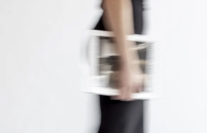 Brand designer holding files for a new project.