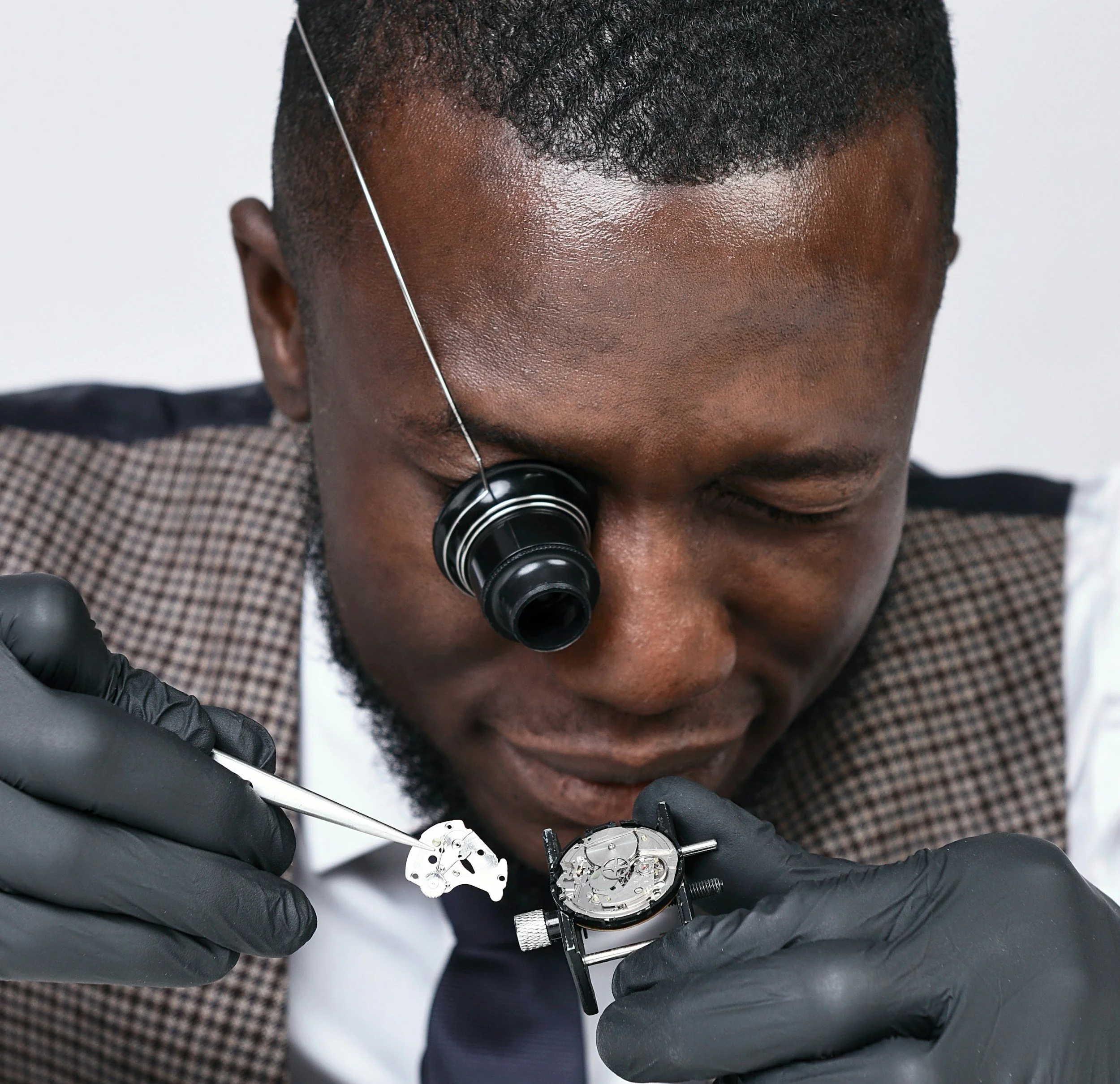 A watchmaker assembling a watch