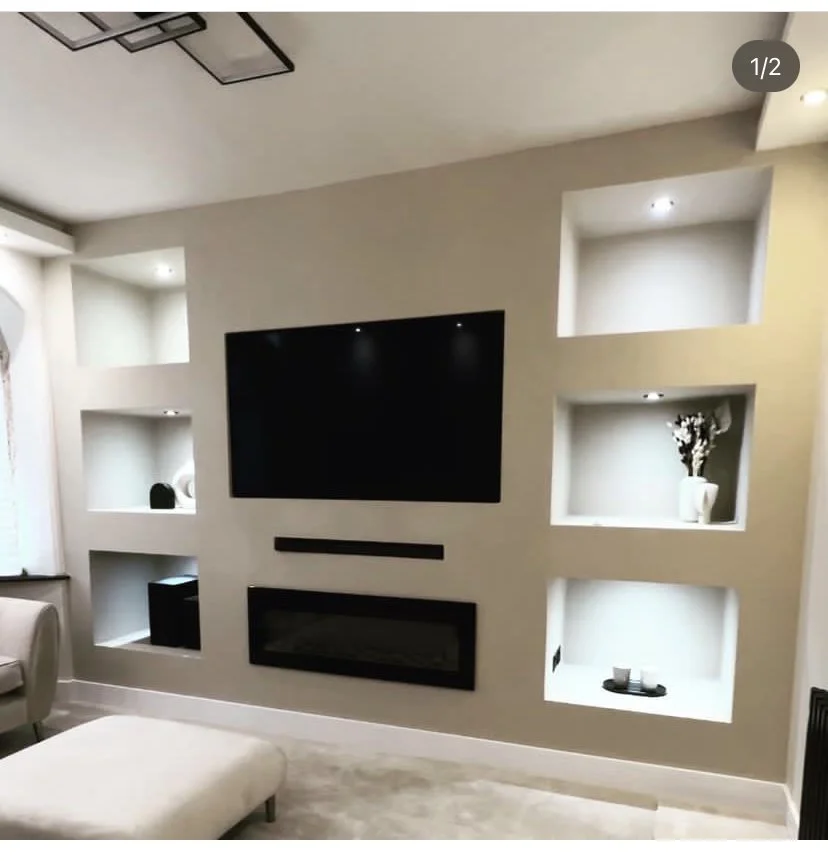 Bespoke media wall installation in Blackpool with built-in shelving and fireplace
