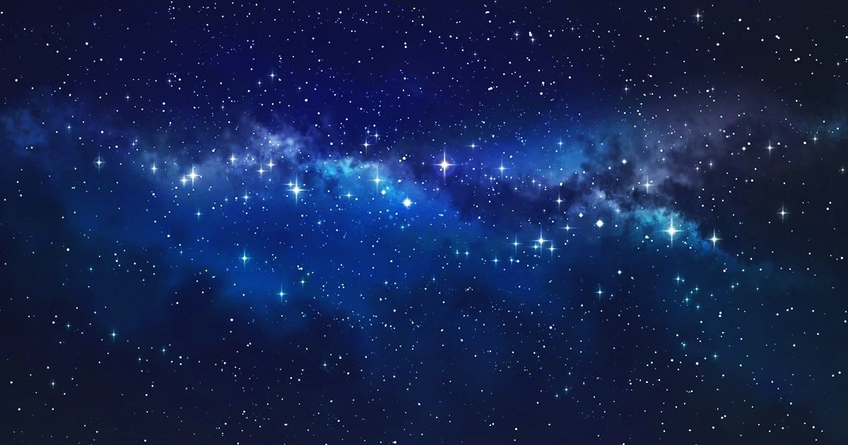 A view of the night sky filled with stars and a visible streak of the Milky Way galaxy.