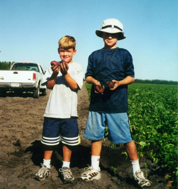 2000s - Sam & Joe Simpson in potato field.