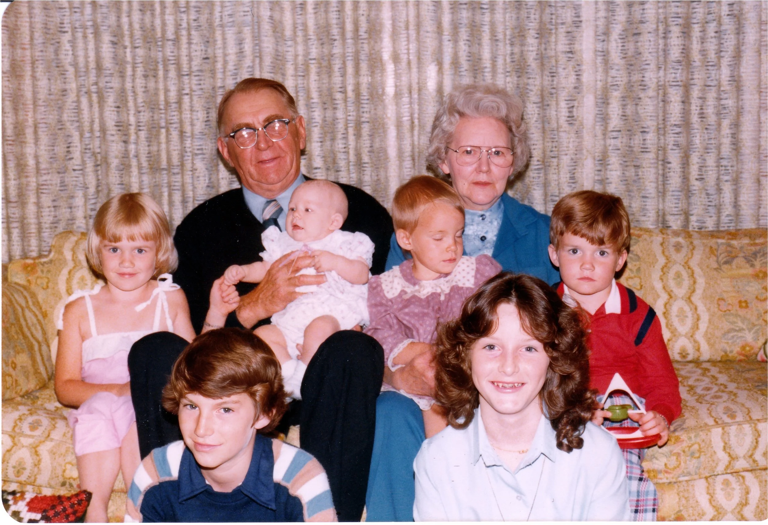 1980 - Joe & Christine Hall with grandkids - Front: Todd & Lisa Hall. Middle: Jolene, Sarah, Julie, & Brandon Hall. Back: Joe & Christine Hall.