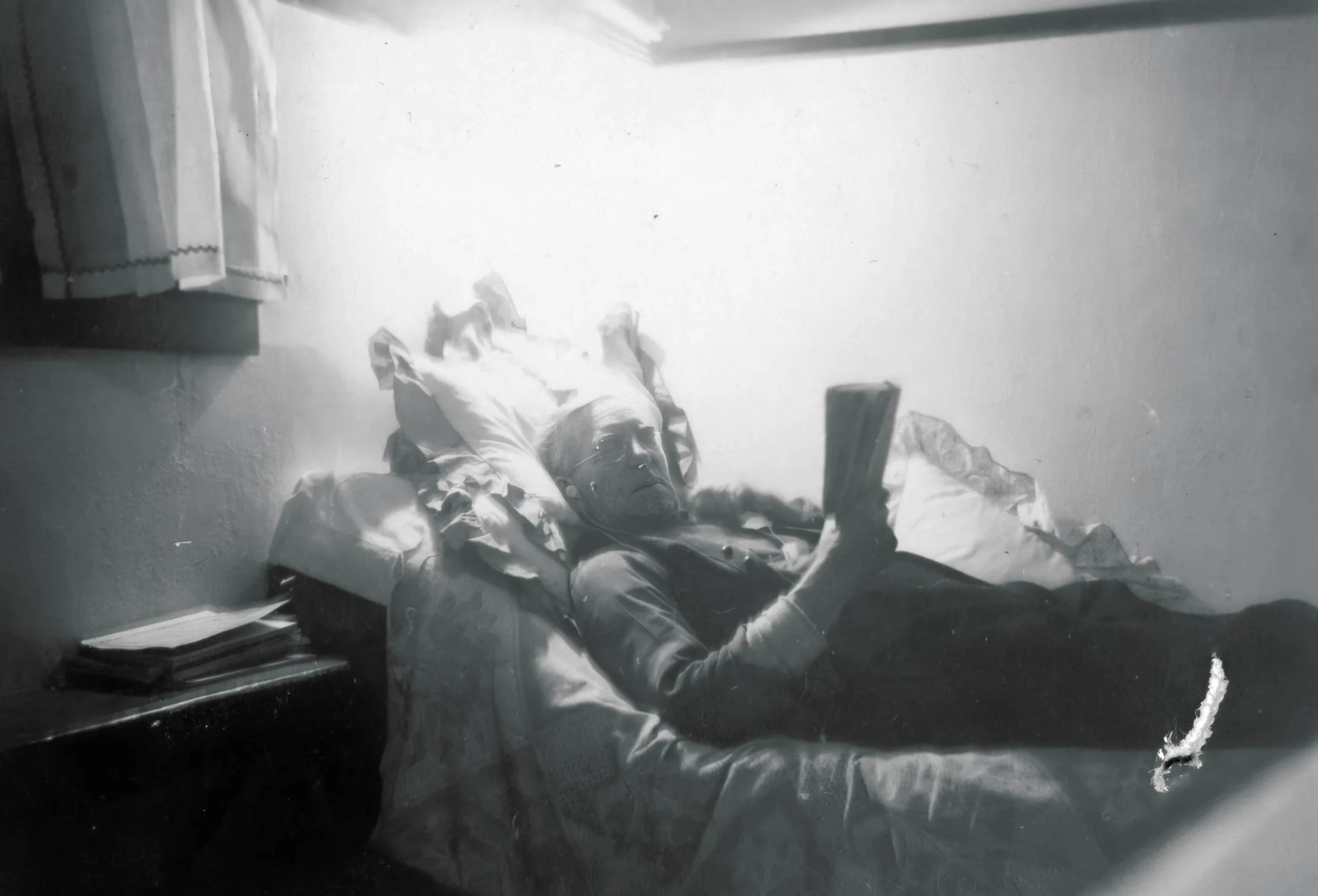 1950s - J.G. Hall on fainting couch.