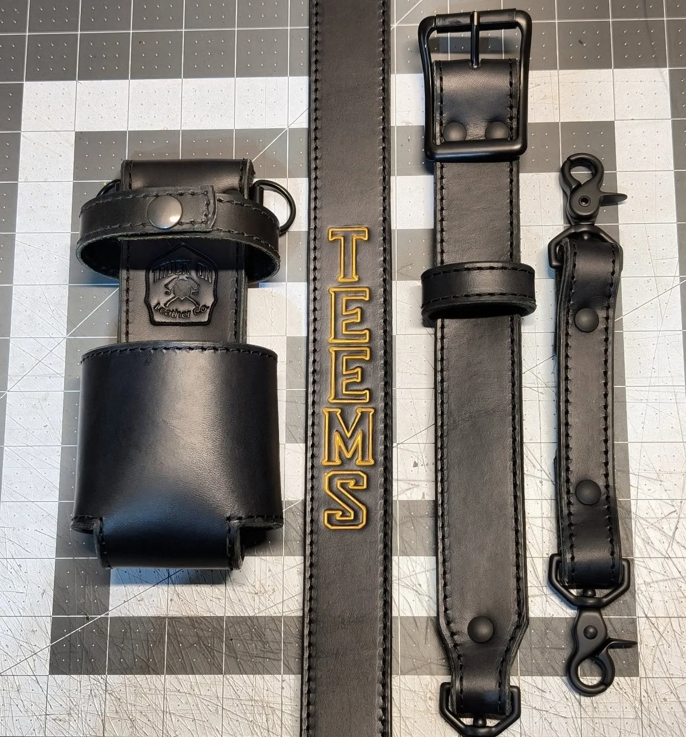 Blacked out strap with a little flash of Gold! 

----Project Info----
Leather color: Black
Stitching: Black
Hardware: Black
Stamps: TOLC
.
.
.
#TruckOn #Jawbtown #radiostrap #glovestrap #leathersmith #fireleather #suspenders #helmetband #leathercraft