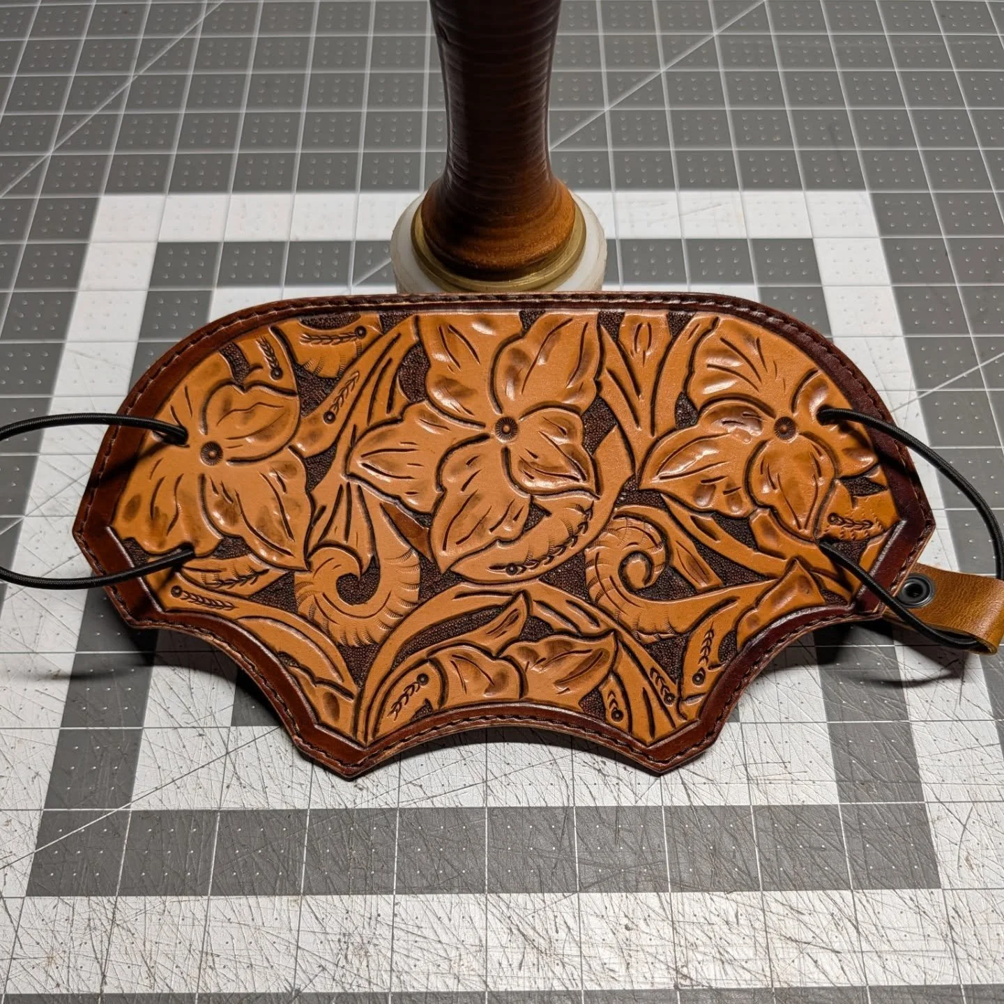 I've been working on some carving and tooling, so I practiced on a FacePiece Cover. A simple floral carving with a backing of "Crazy Horse" (fancy name for some cool looking leather).