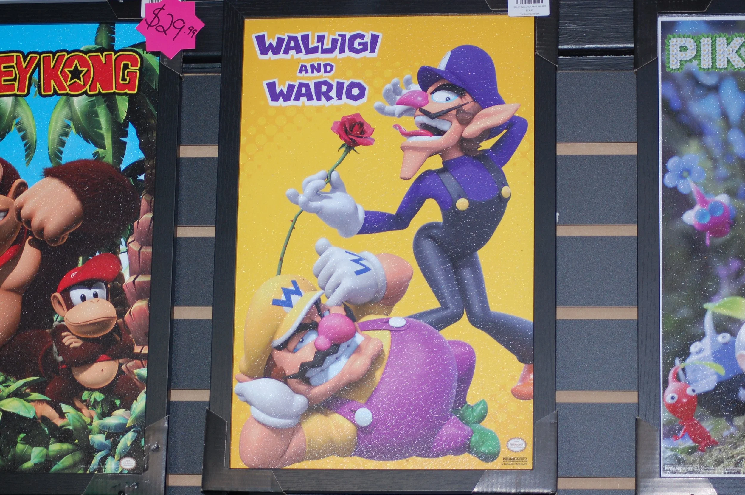 Poster of Waluigi and Wario characters from Nintendo, with Waluigi holding a rose and Wario lying on a large purple and yellow fruit, set against a yellow background.