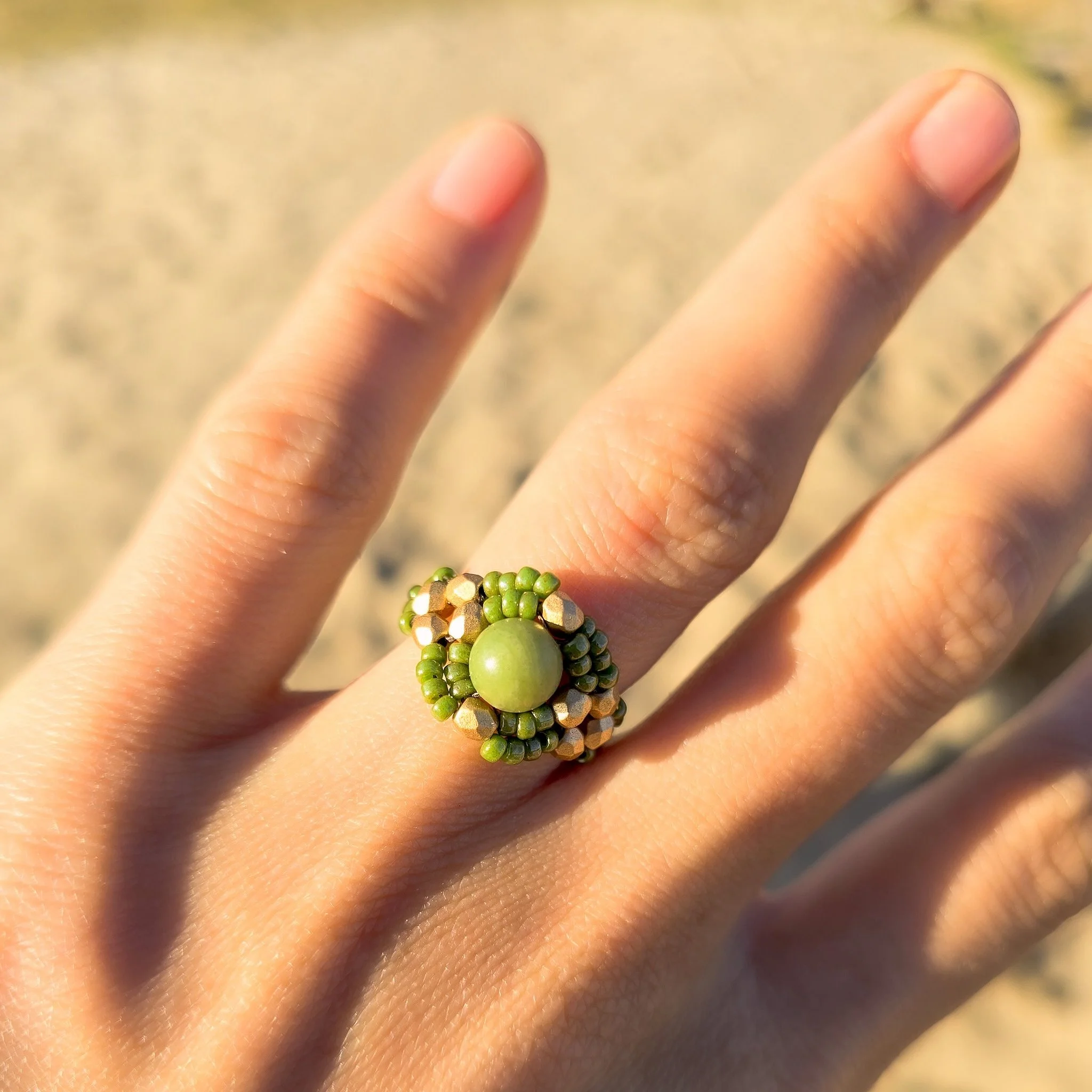 Serpentine, held in shades of green and gold: 
a small talisman of grounding, growth, and gentle renewal.