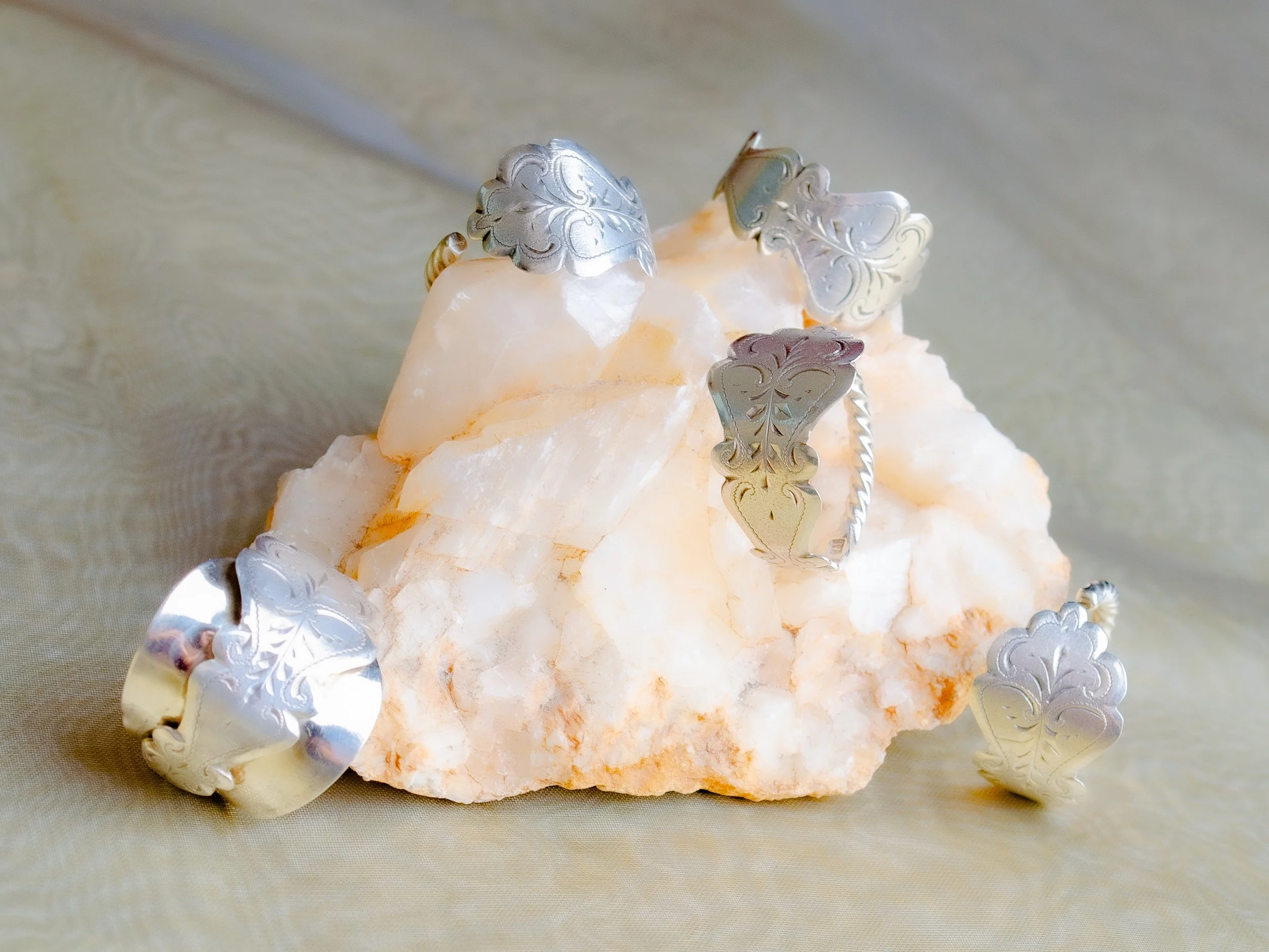 Vintage Dutch 925 sterling silver spoon rings with baroque engraving and rope edge, handmade by Moonlit Manor Netherlands, on white mineral crystal