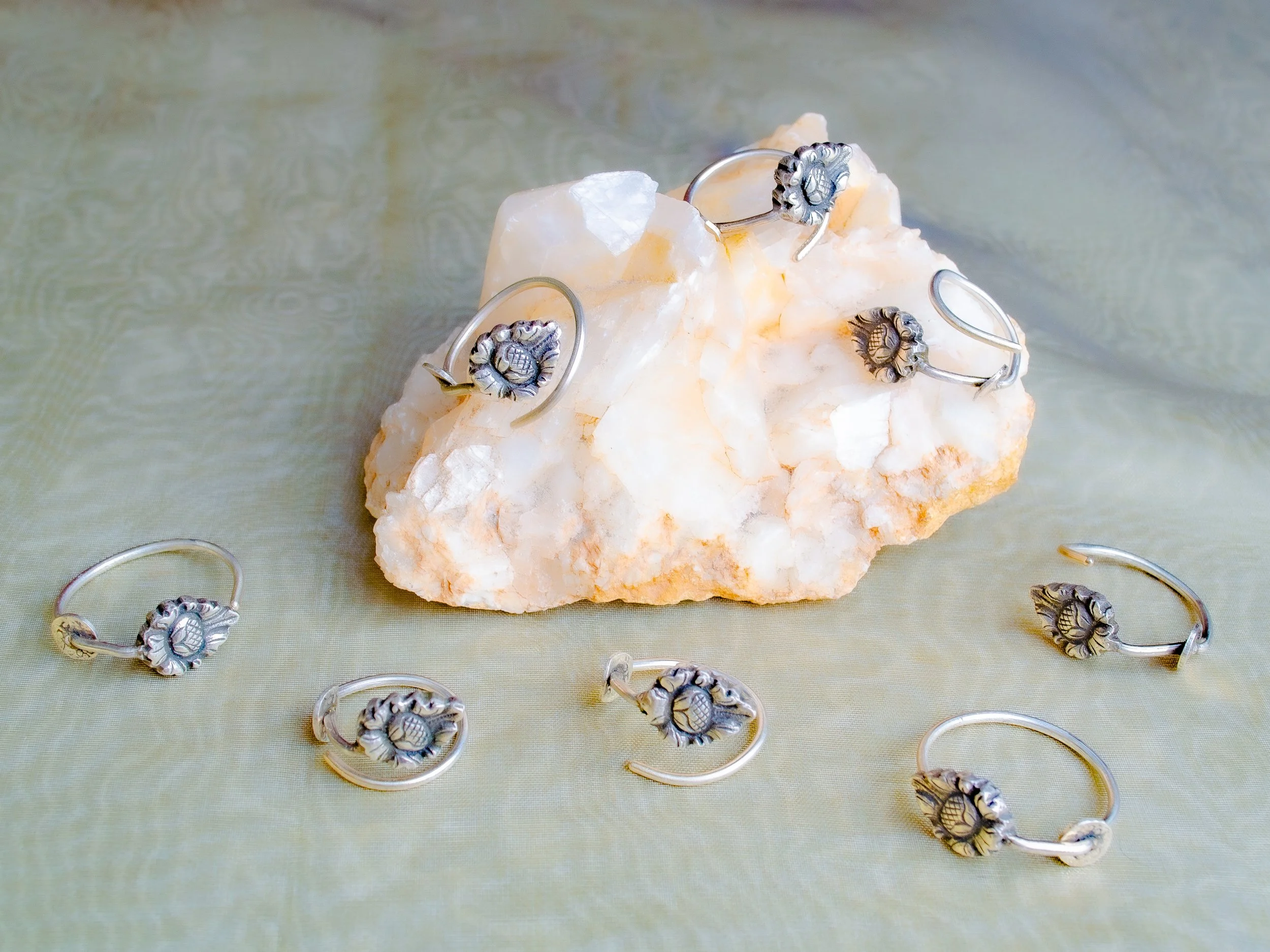 Vintage German 800 silver rings handmade in the Netherlands from cocktail picks, ornate Jugendstil flower motif, on white mineral crystal