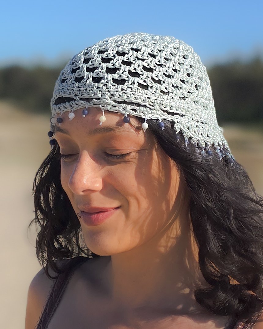 Portrait of the maker of Moonlit Manor wearing a handcrafted headpiece and symbolic artisan jewelry, representing the brand's luxury slow fashion identity.