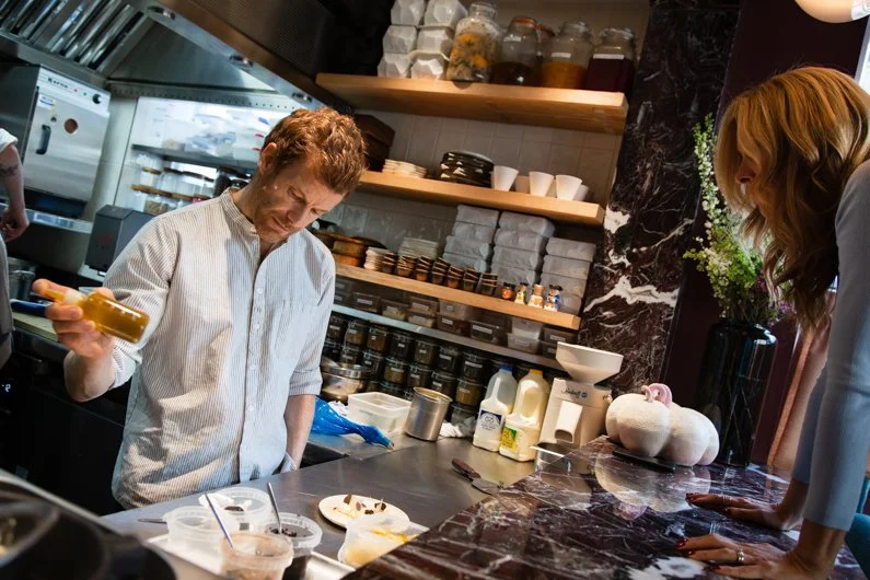 Muse - Lidija watching Tom behind the kitchen.jpg