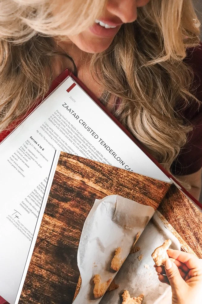 Lidija holding open Devour book