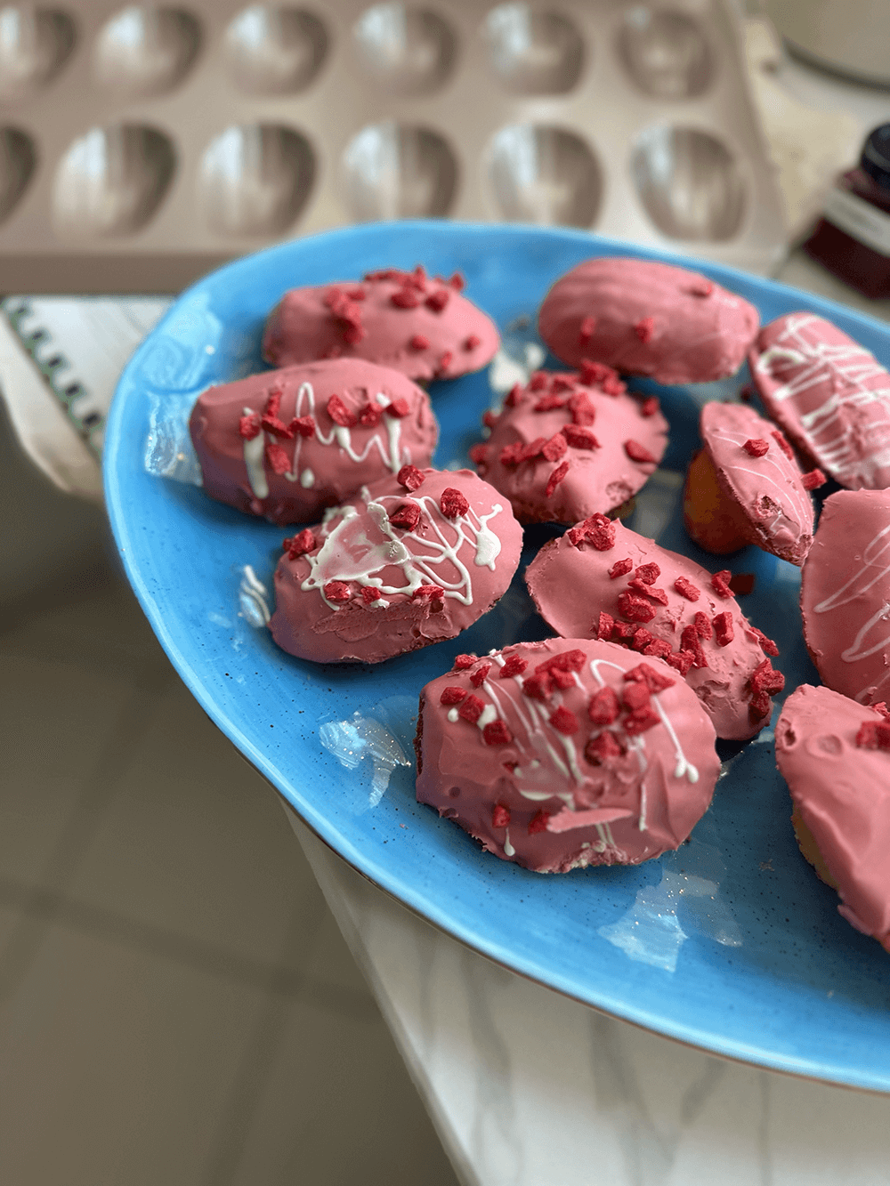 RASPBERRY MADELEINES WITH WHITE CHOCOLATE GLAZE