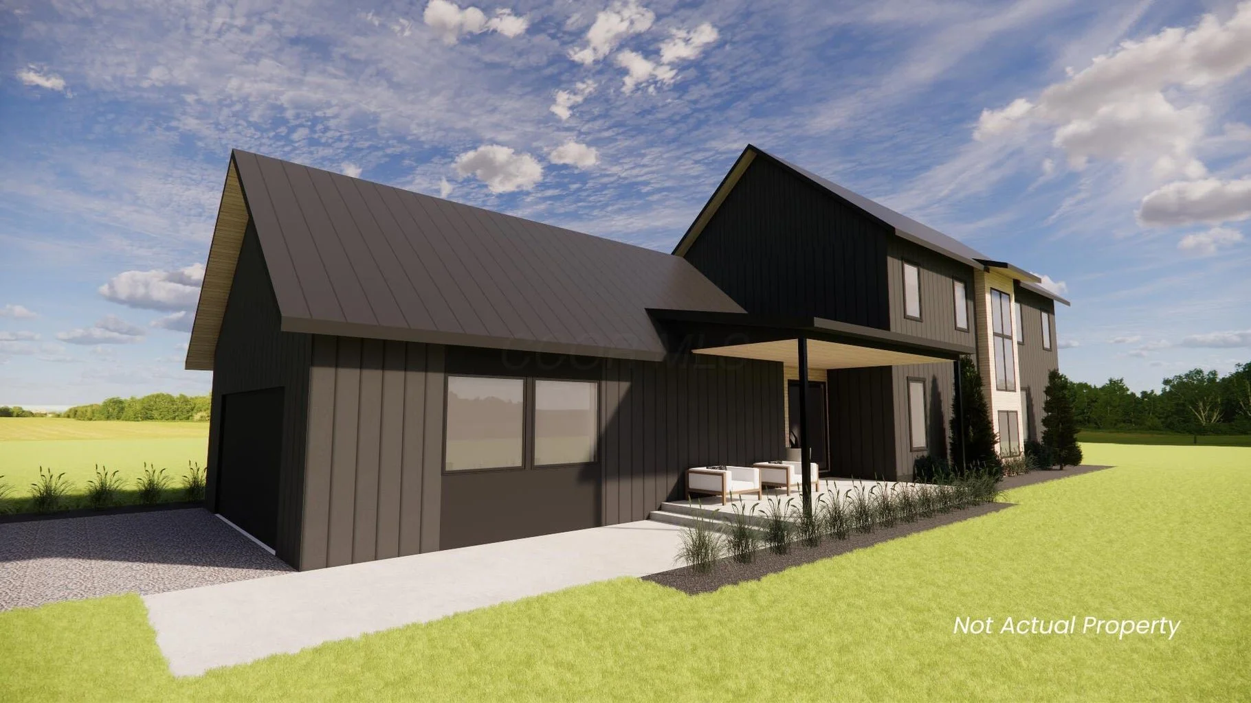 A modern two-story house with black exterior siding, a metal roof, and a small outdoor sitting area with two white chairs. The house is surrounded by a grassy lawn and a clear blue sky with scattered clouds.