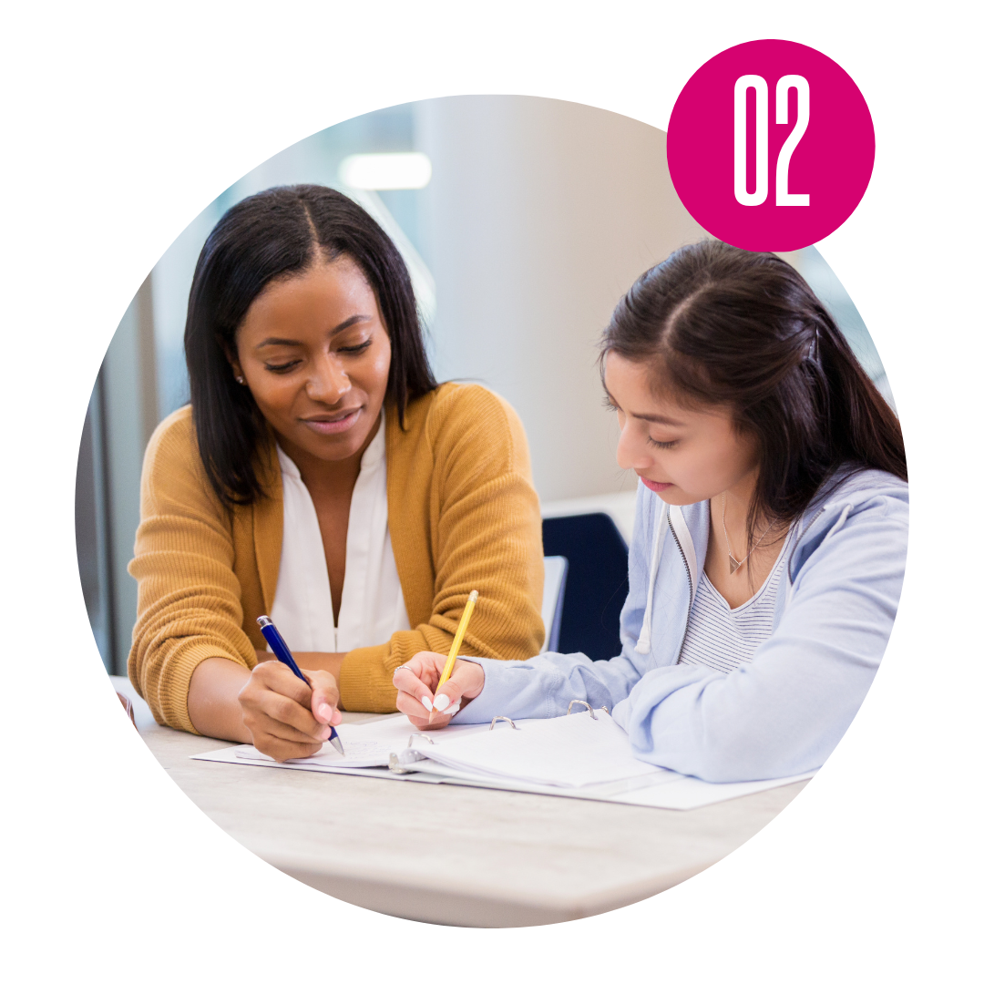 An image of a counselor working with a high school student.