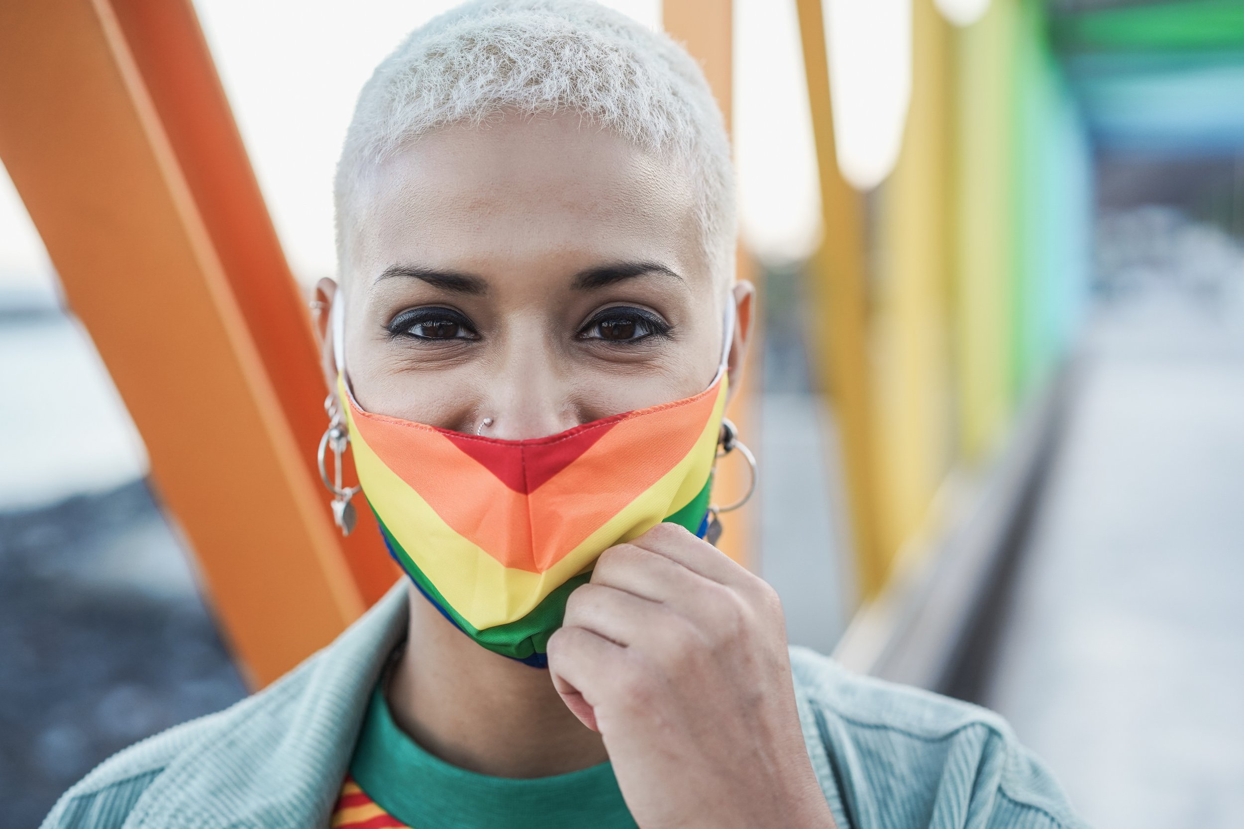 Woman wearing a rainbow face mask