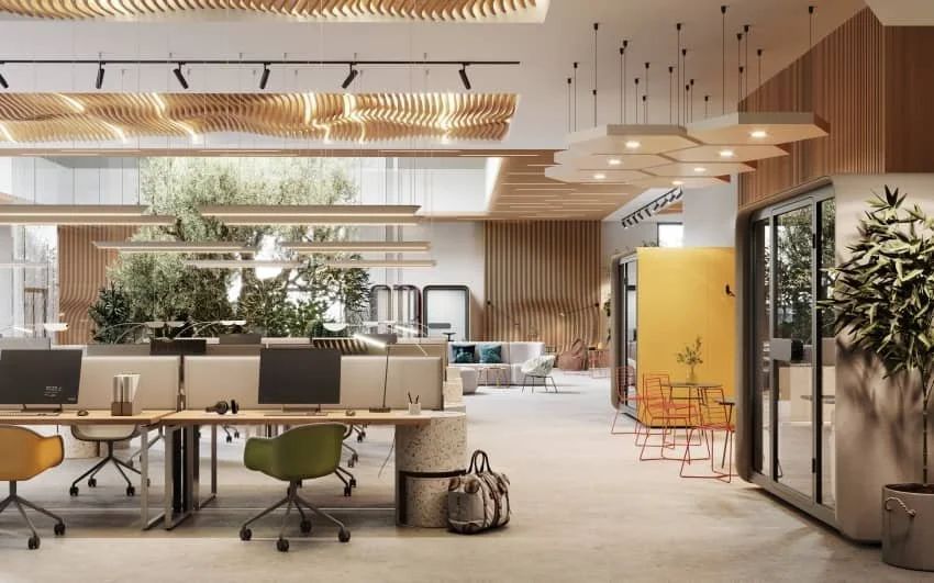 Modern open-concept office space with workstations, large windows, and decorative wood panels, featuring plants and colorful chairs.