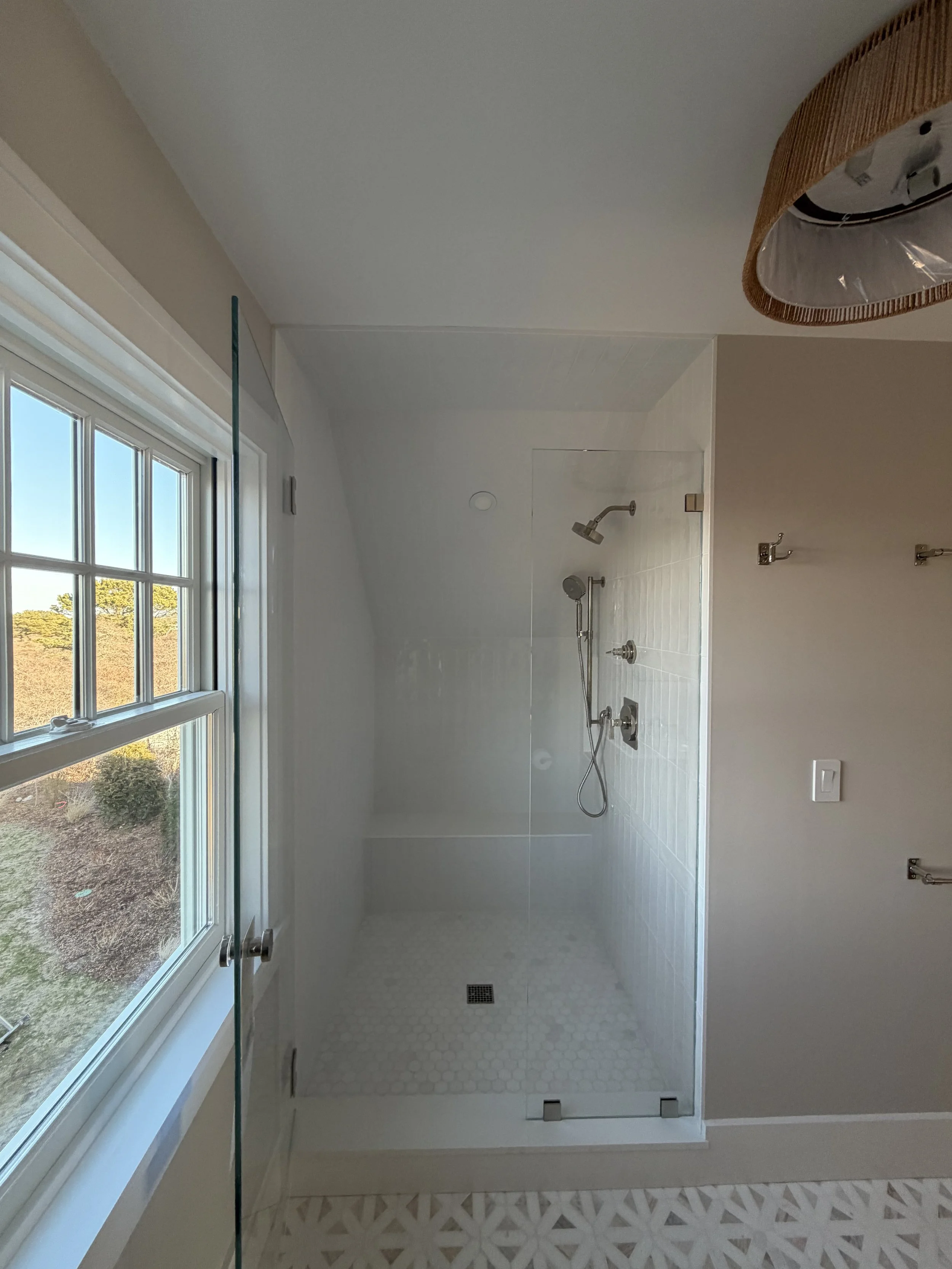 High-end bathroom tile installation featuring premium materials, custom layouts, and flawless craftsmanship for elegant, modern bathrooms.