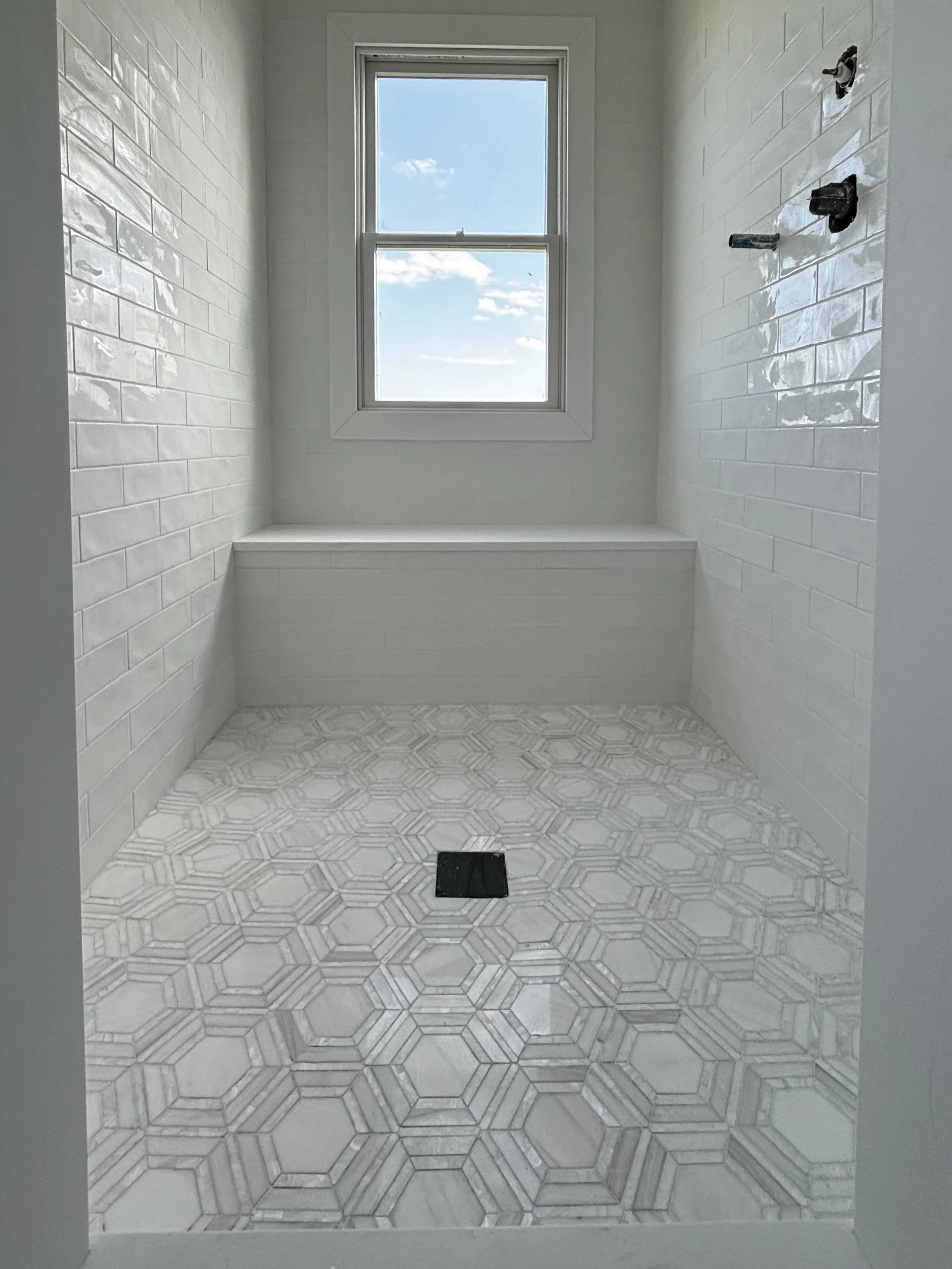 Professional bathroom tile installation in MA. Specializing in shower walls, floors, and custom tile craftsmanship.