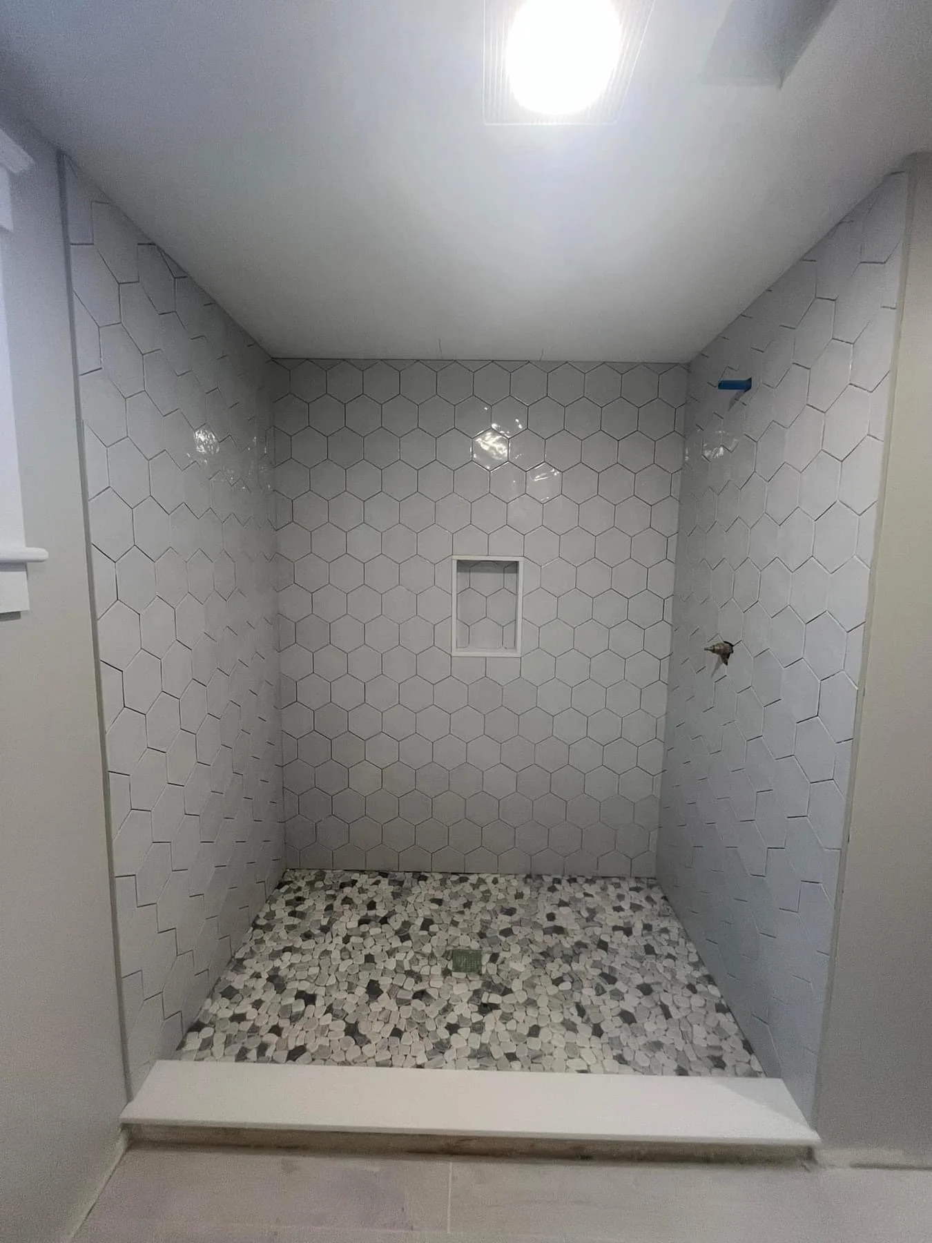 Professional bathroom tile installation specializing in showers, floors, and custom designs with durable, waterproof craftsmanship.