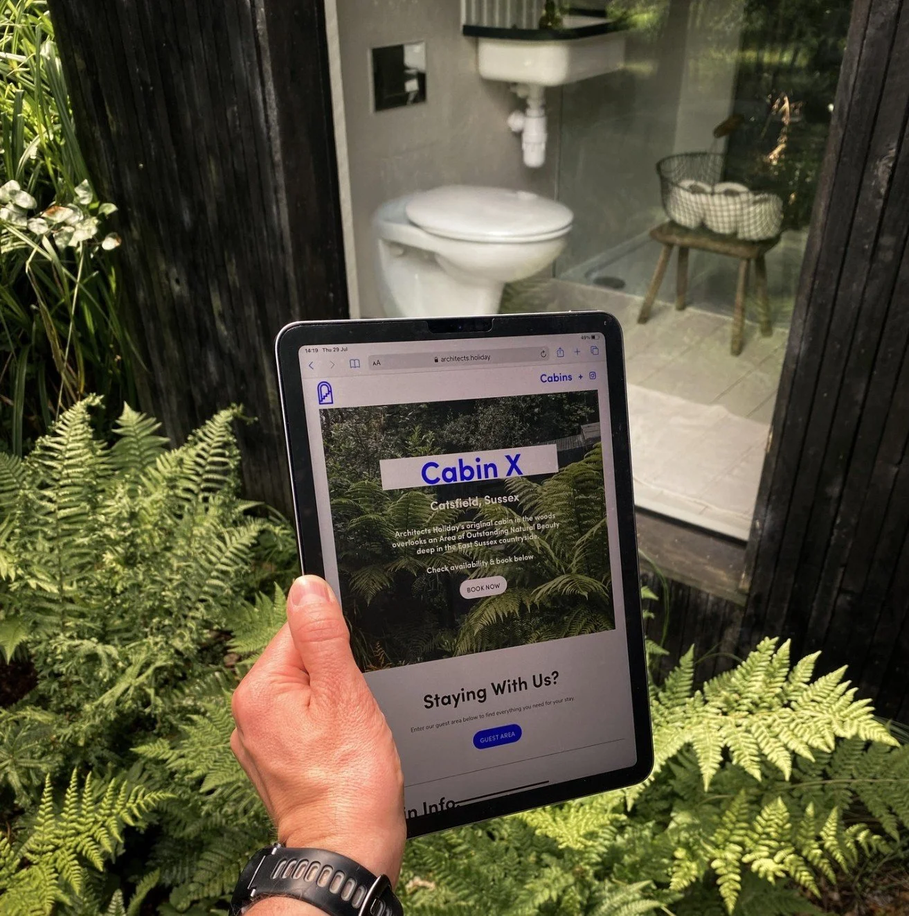 Black background with a white geometric circular design formed by interconnected rectangular shapes.