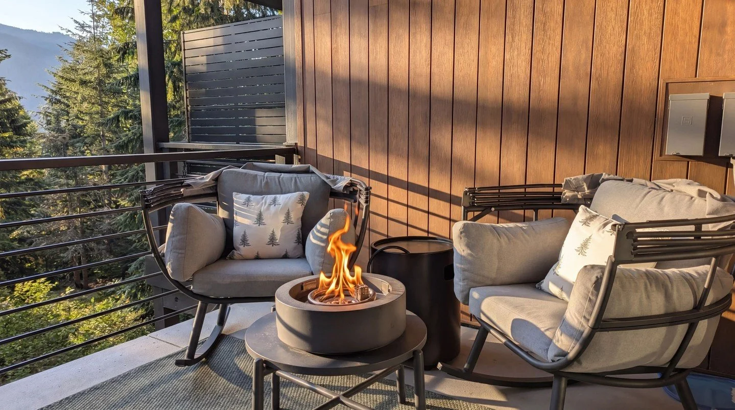 Retreat to our intimate balcony lounge at Hyak. Cozy up in cushioned armchairs by the private fire pit as the sun dips below the Cascades. It&rsquo;s the perfect spot for quiet connection and forest views. Your mountain sanctuary awaits. #SnoqualmieP