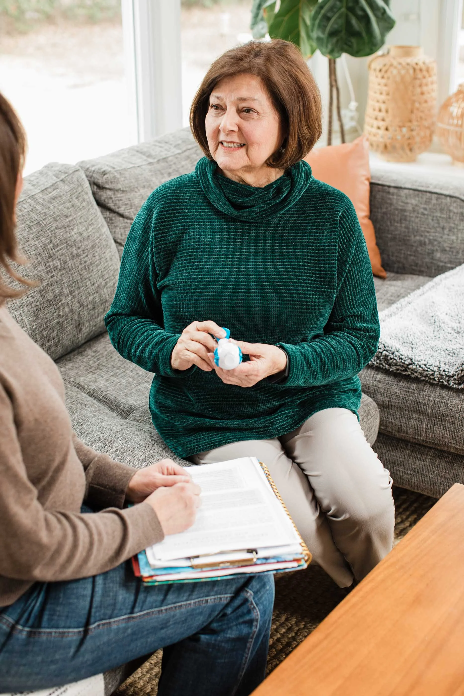 Speech therapist Kristen Calhoun leads a patient in a guided breathing exercise.