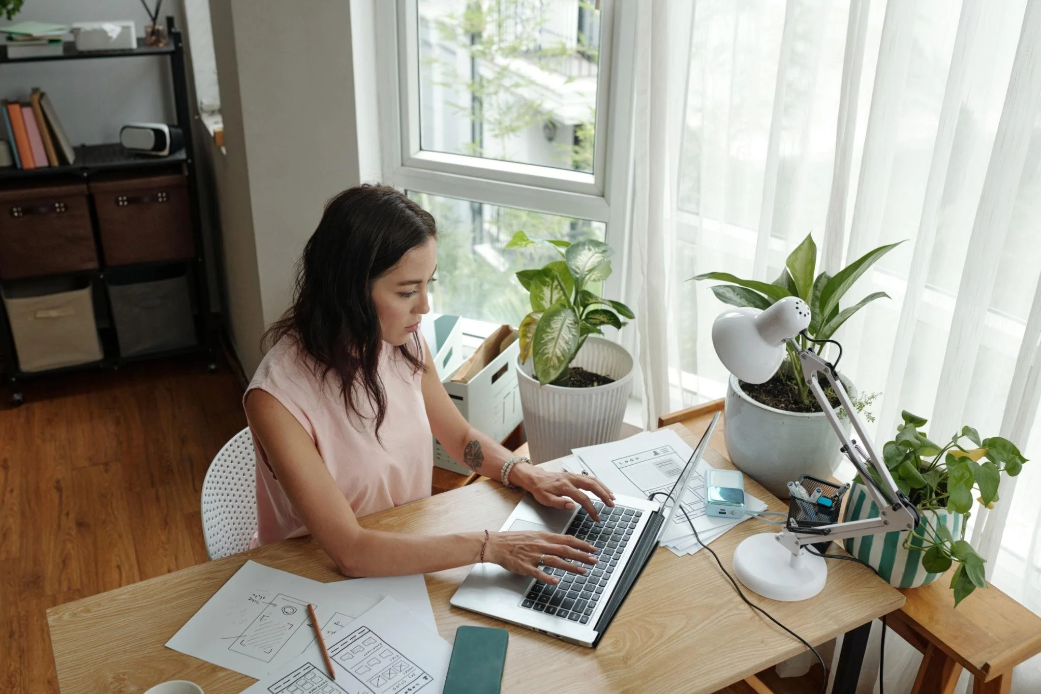 Professional woman experiencing work stress and anxiety while working from home, concept for online therapy support