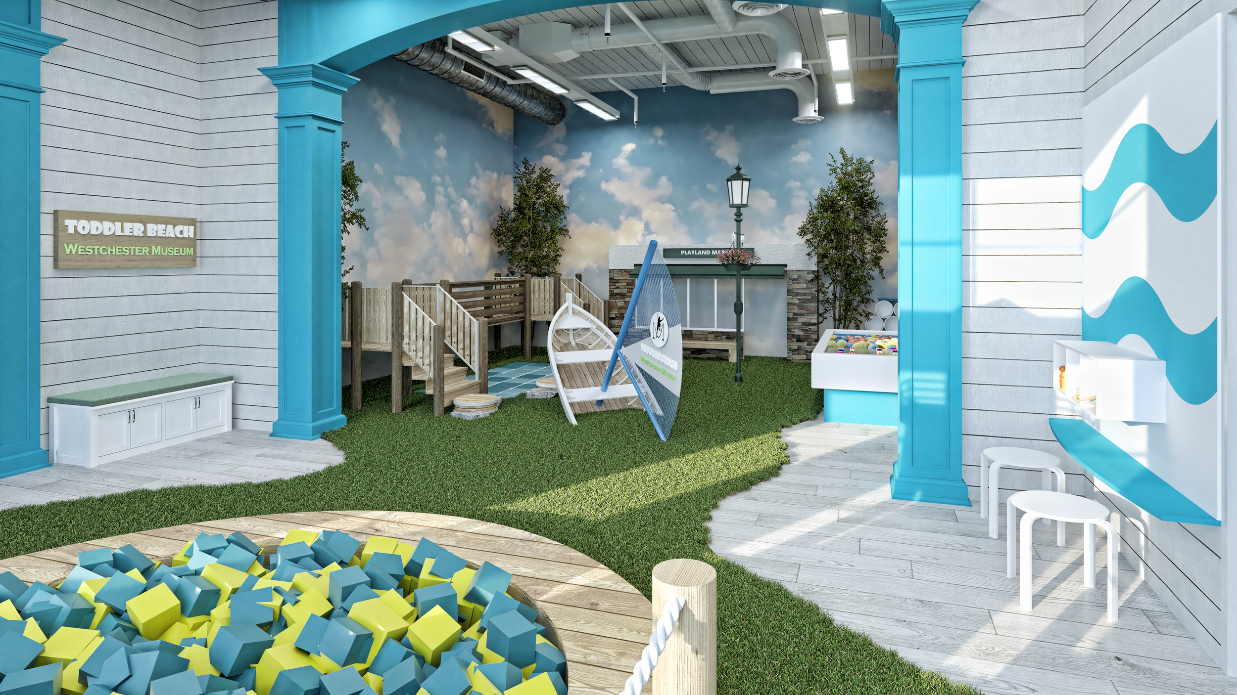 Indoor play area at Toddler Beach exhibit with wooden play structure, blue and white wave decor, foam block pit, and mural of sky and clouds.