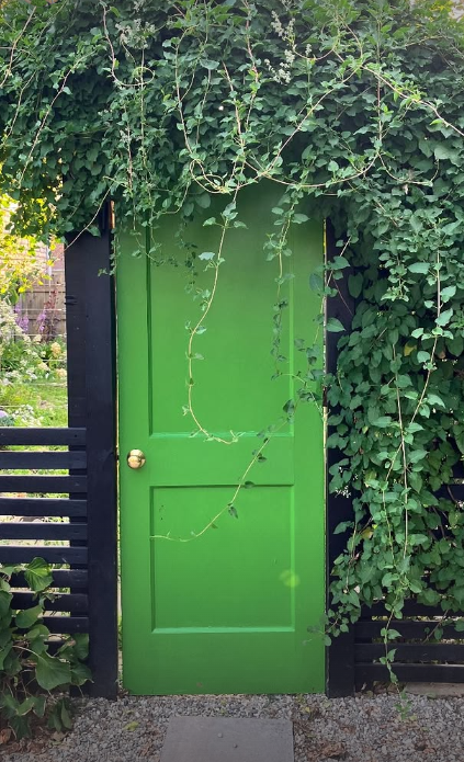 The first thing I added was a door. The door stood there for a year before the fencing was added on either side. A fall clematis was added to create further mystery.
