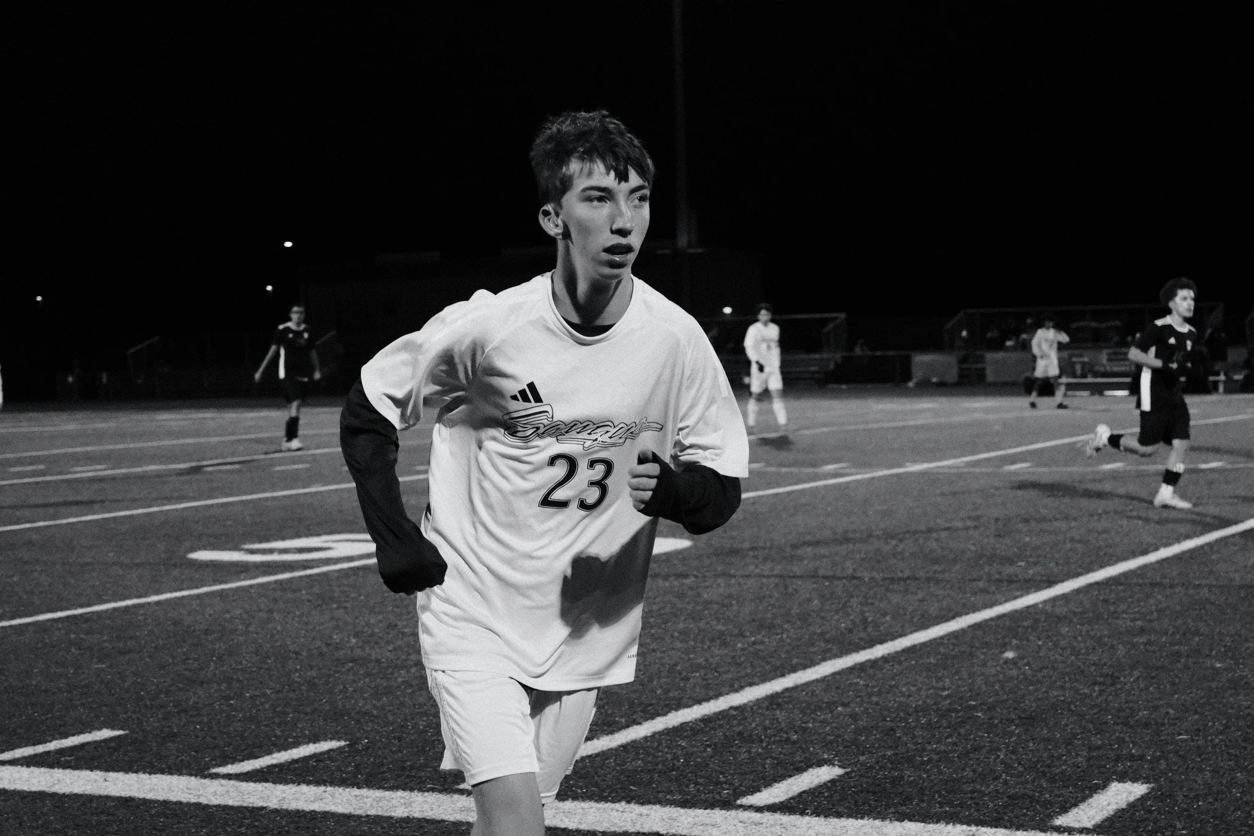 Soccer player running on field in Oregon
