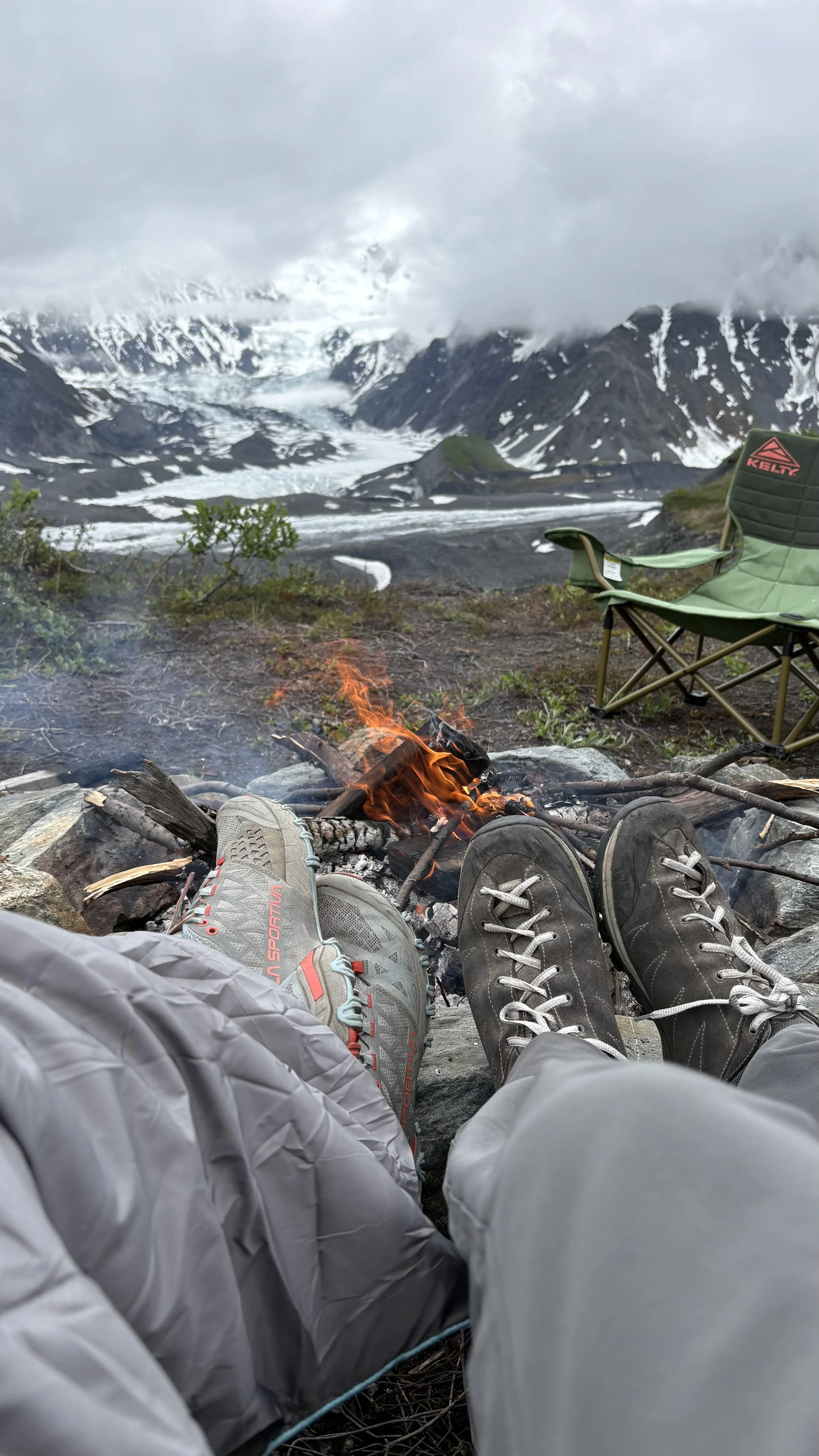 Glacier hut guests enjoying a fire.jpeg