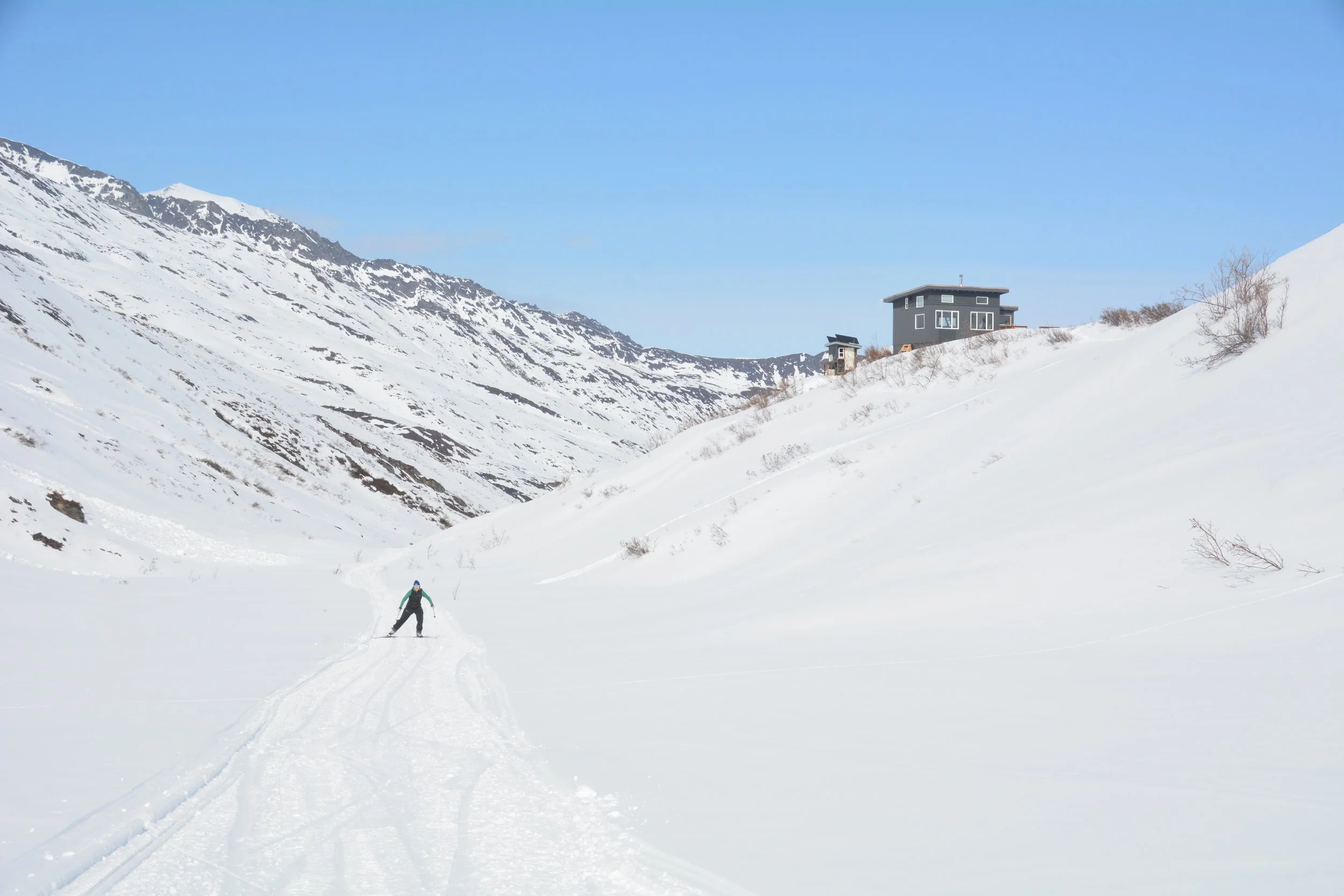 XC skier with hut in background.JPG