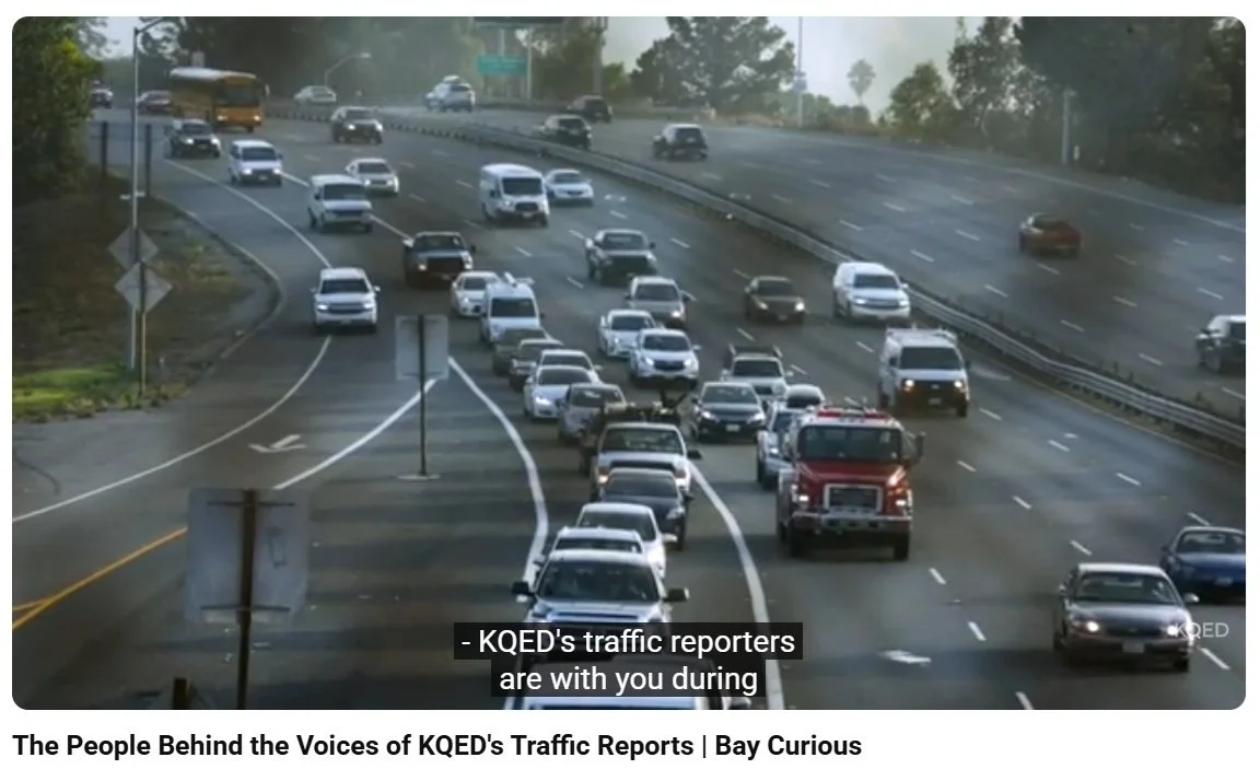 Multiple cars involved in a highway accident with emergency response vehicles on the scene and traffic congestion.