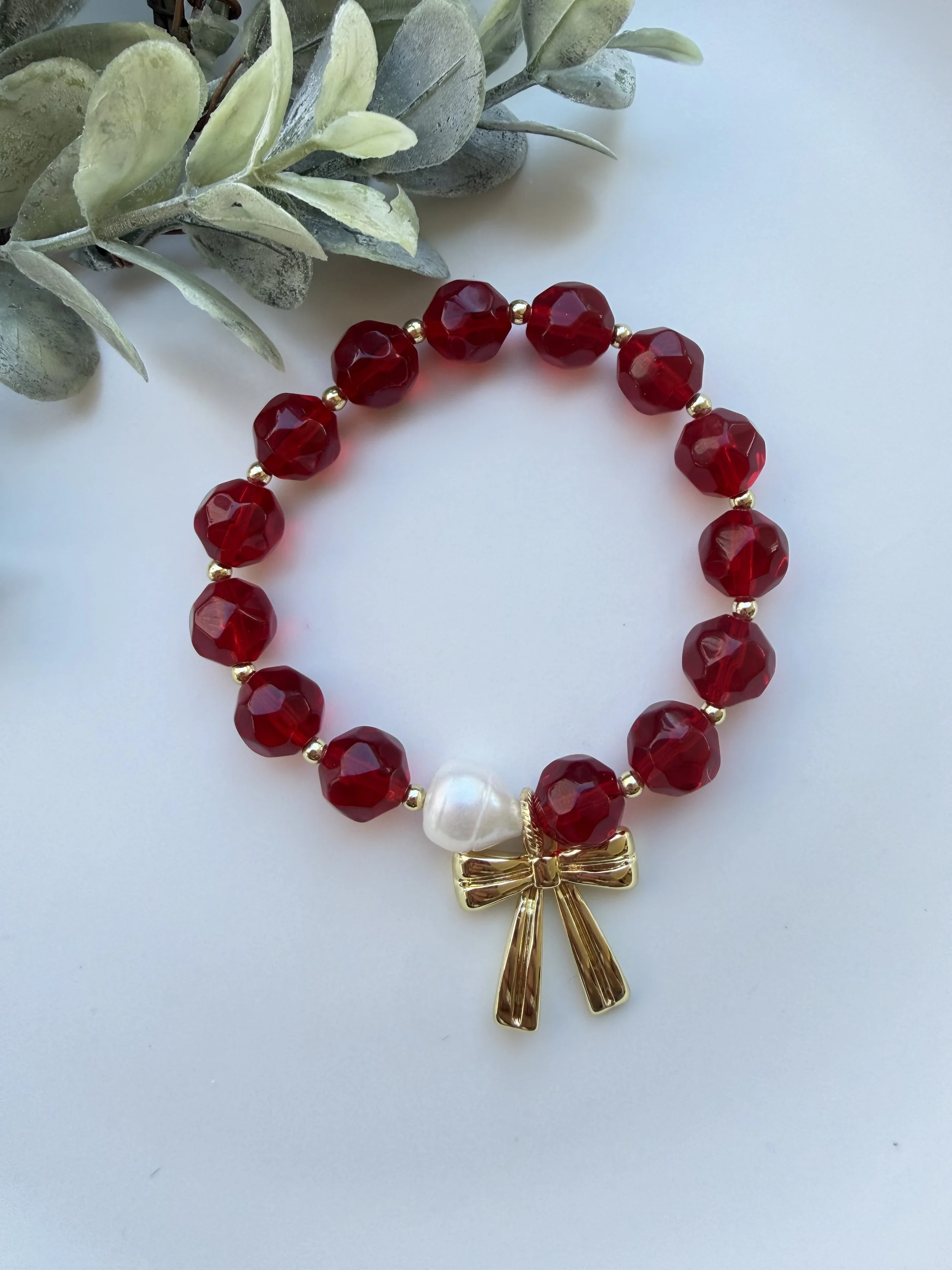 Red Faceted Beaded Bracelet with Gold Bow Charm