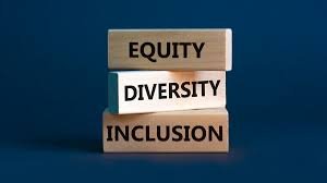 Stacked wooden blocks labeled Equity, Diversity, and Inclusion against a blue background.
