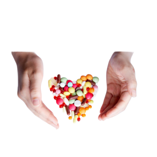 Two hands holding a heart-shaped arrangement of colorful pills and capsules.