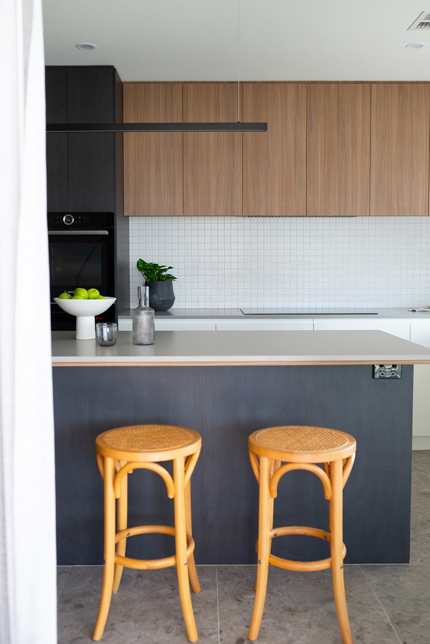 Timber, black and white family kitchen by Banksia Projects