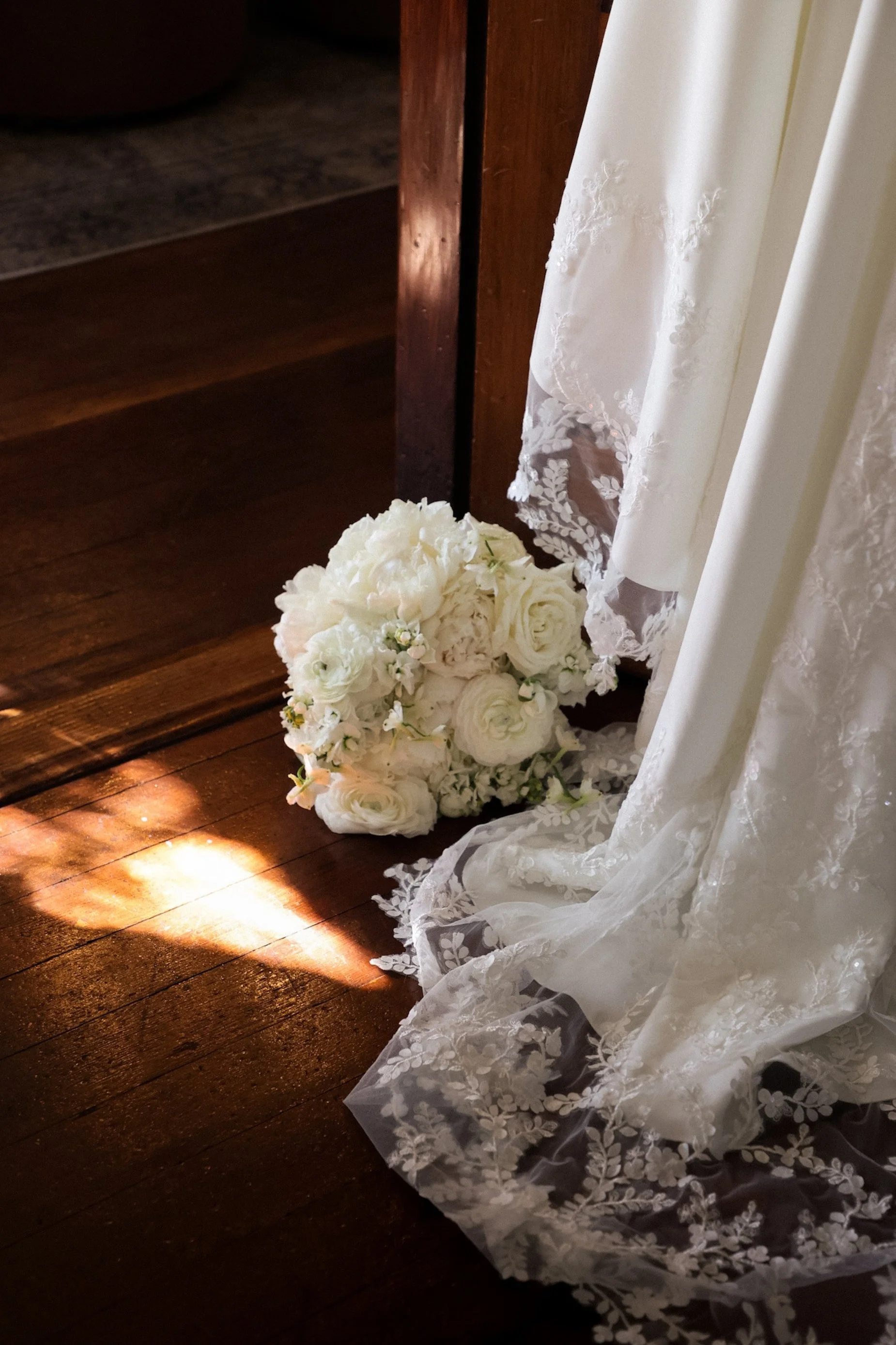 brides dress and white rose bouquet.jpg