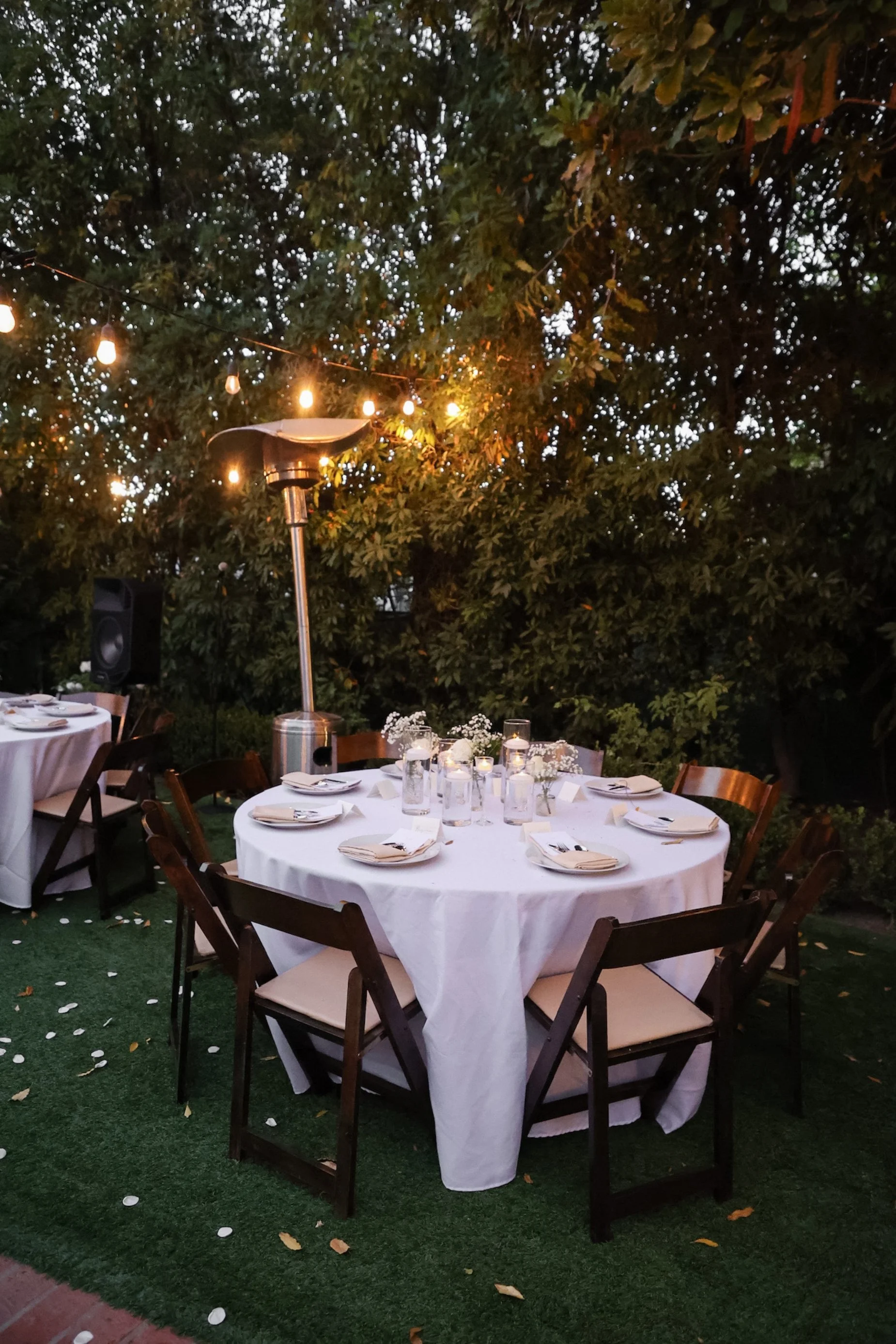 wedding reception table setup under string lights.jpg