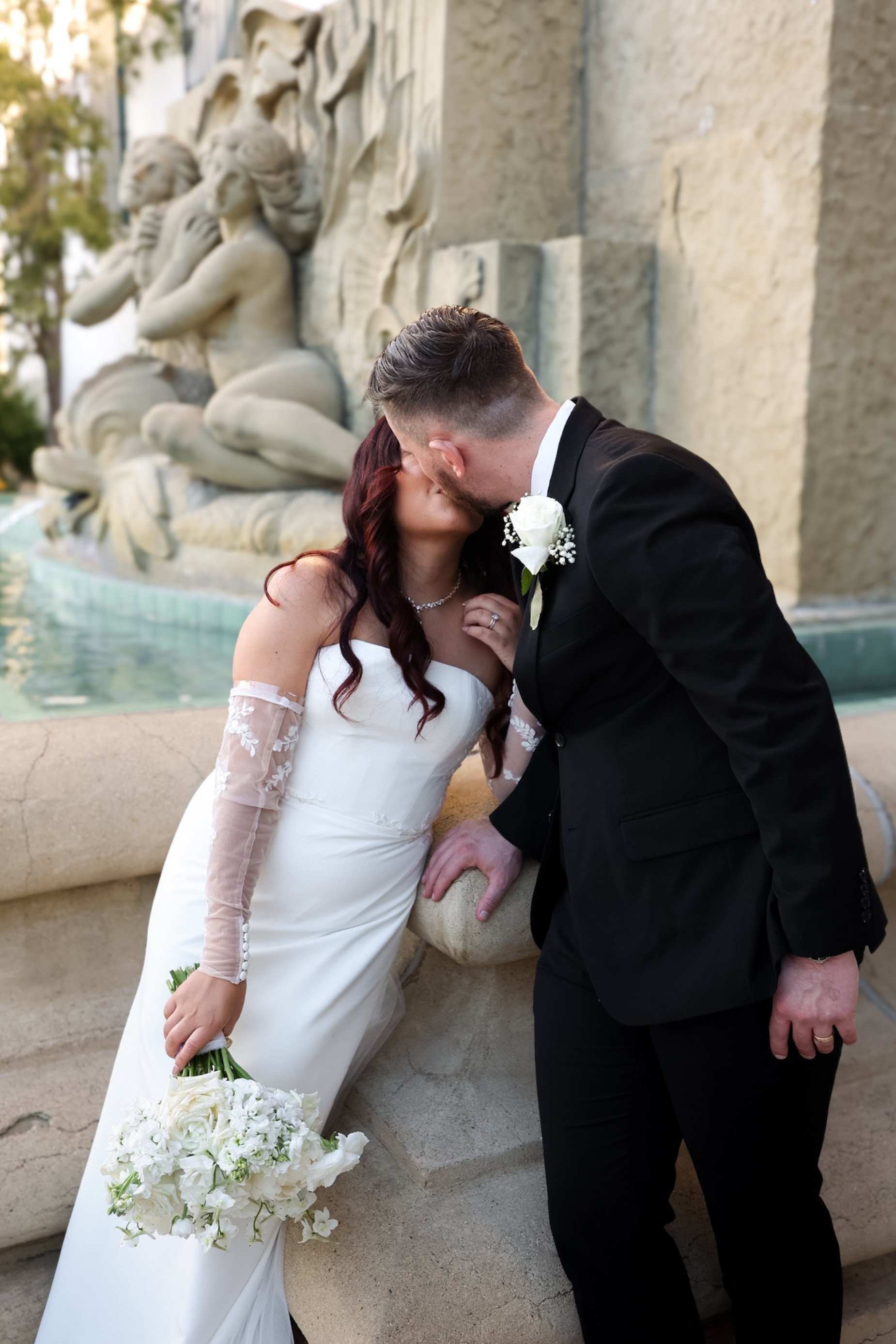 bride and groom outside fountain venue.jpg