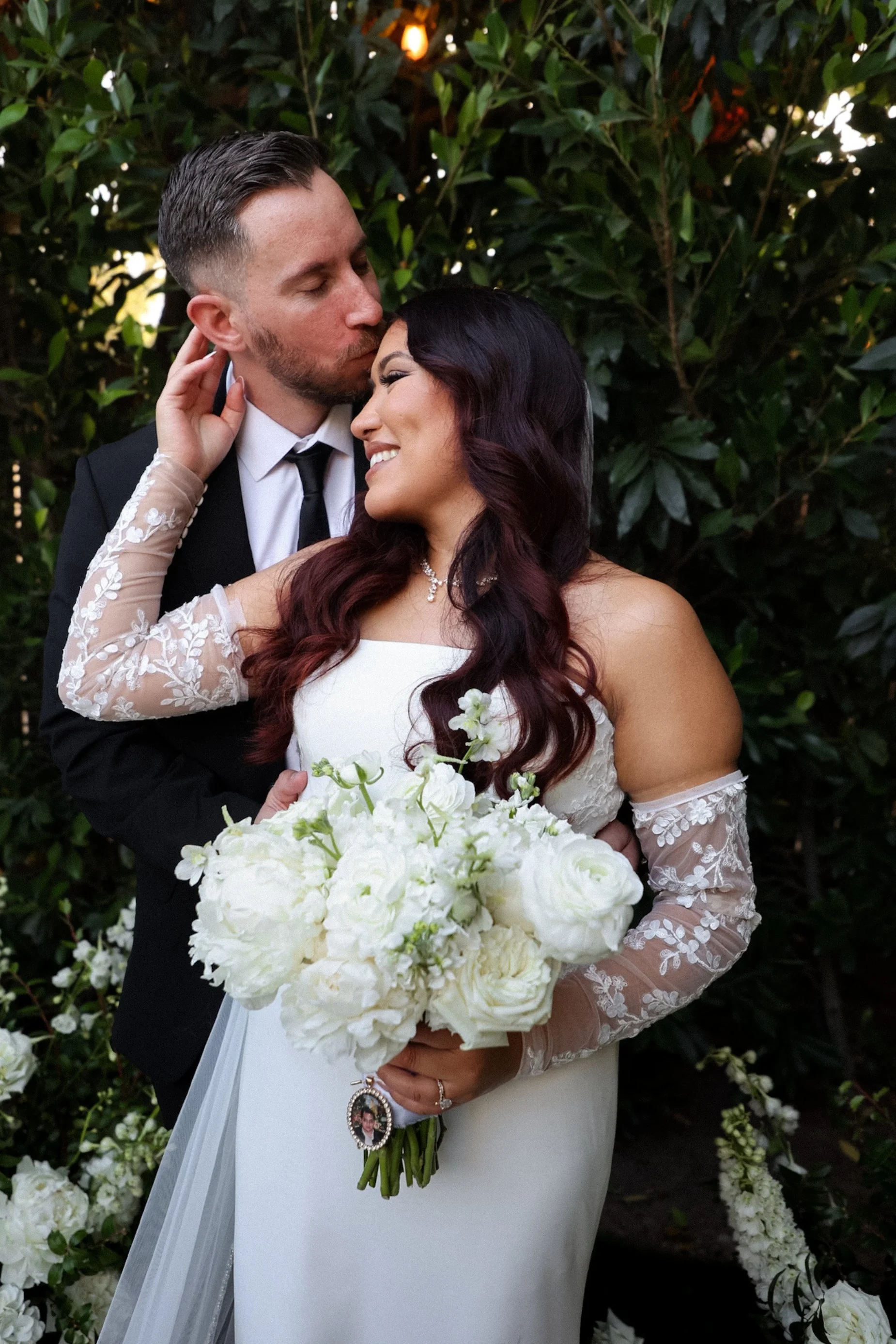 groom kissing bride on forehead.jpg