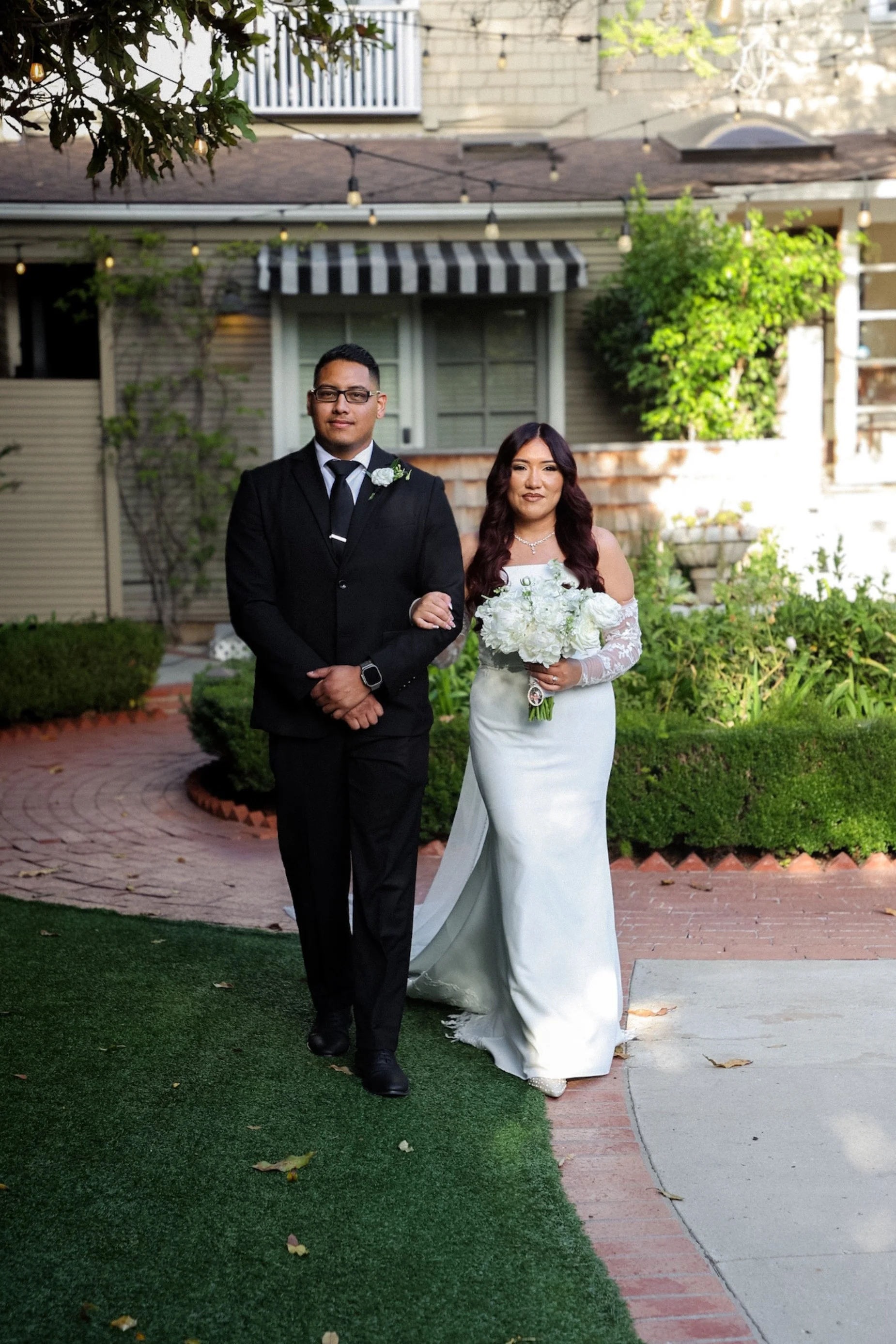 bride walking down aisle at intimate outdoor venue.jpg