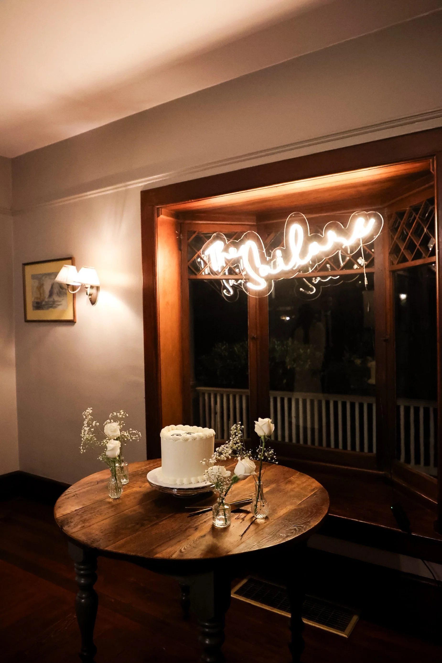 neon sign and cake table.jpg