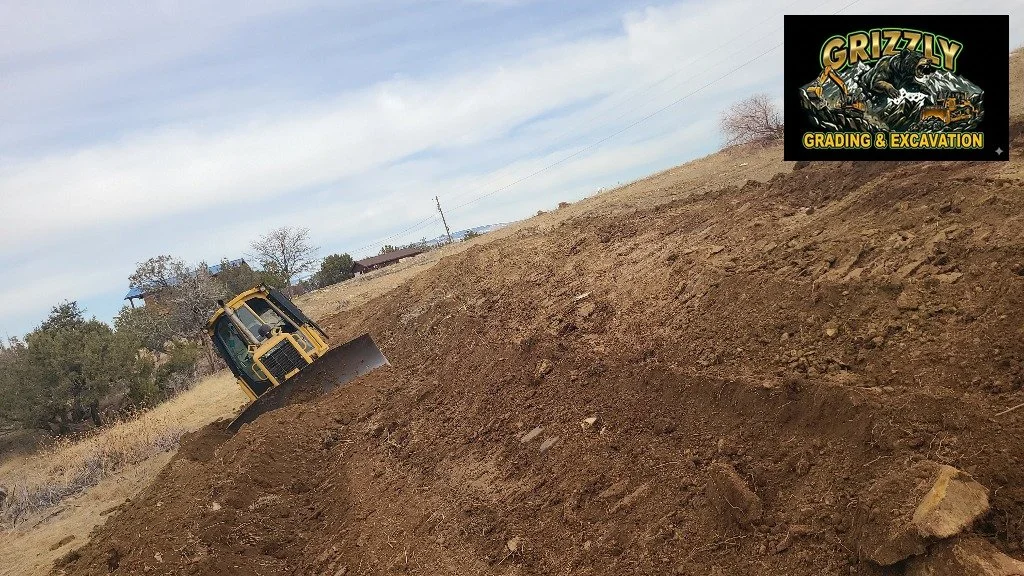 Pond reclamation in the Crawford area. Dozer on the steep bank reshaping the slope, then loader and excavator cleaning the bottom.

Two machines working different parts of the same problem &mdash; that is how you do a pond right.

Crawford, CO. | (97